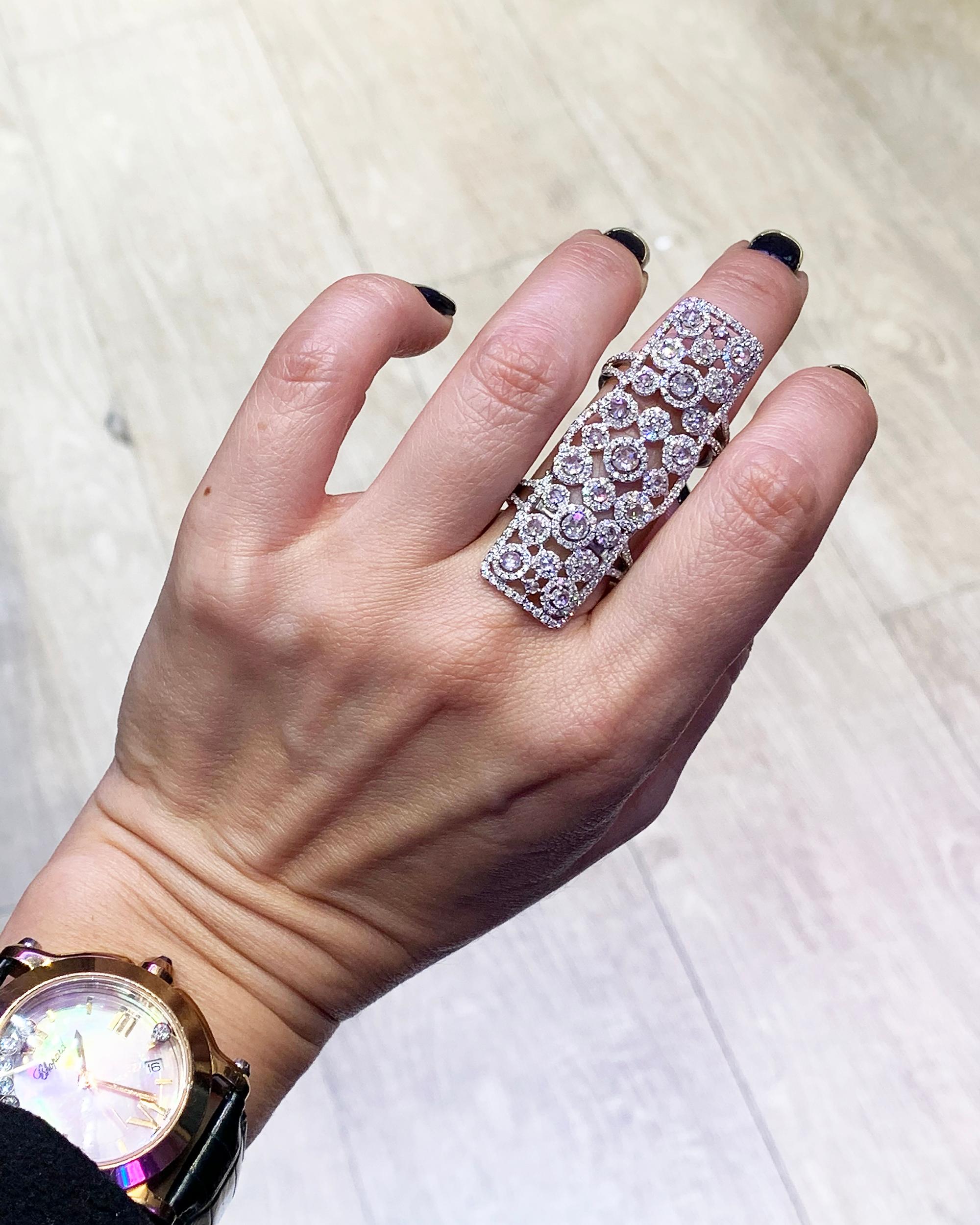 Knuckle rings have always been trendy and stylish, they add chic to your daily look. This ring is embellished with 3.00 carats of round diamonds mounted in 18K white gold. 
The diamonds are equivalent to G-H colors, VS-SI clarity. 
The ring weighs