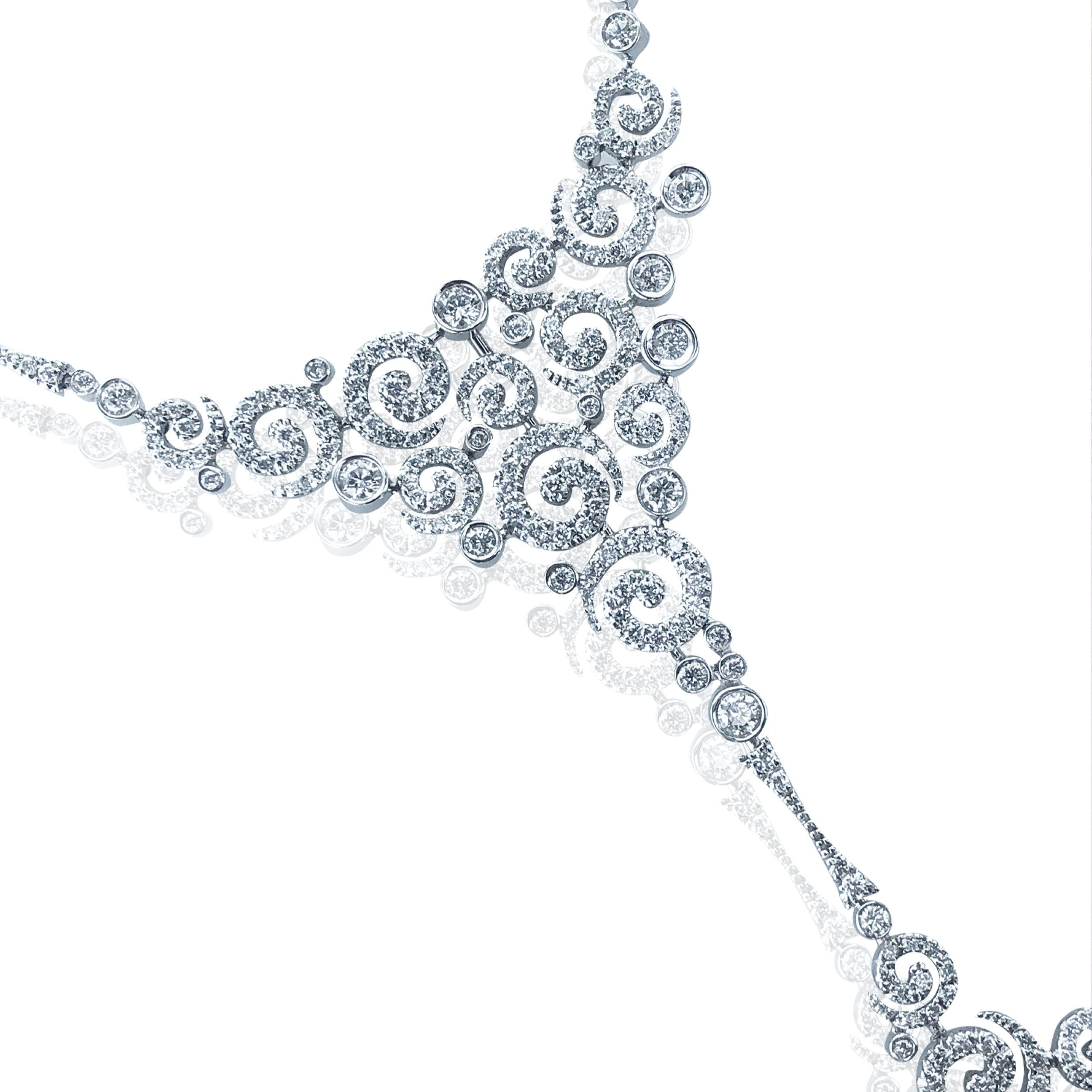 This diamond 3.00 Carat large swirl Necklace, sits beautifully on a 18kt white Gold cable chain. 

With a fixed centre piece of multiple diamond swirls leading down to a dangling square collection of swirls. 

A unique ornate diamond necklace that