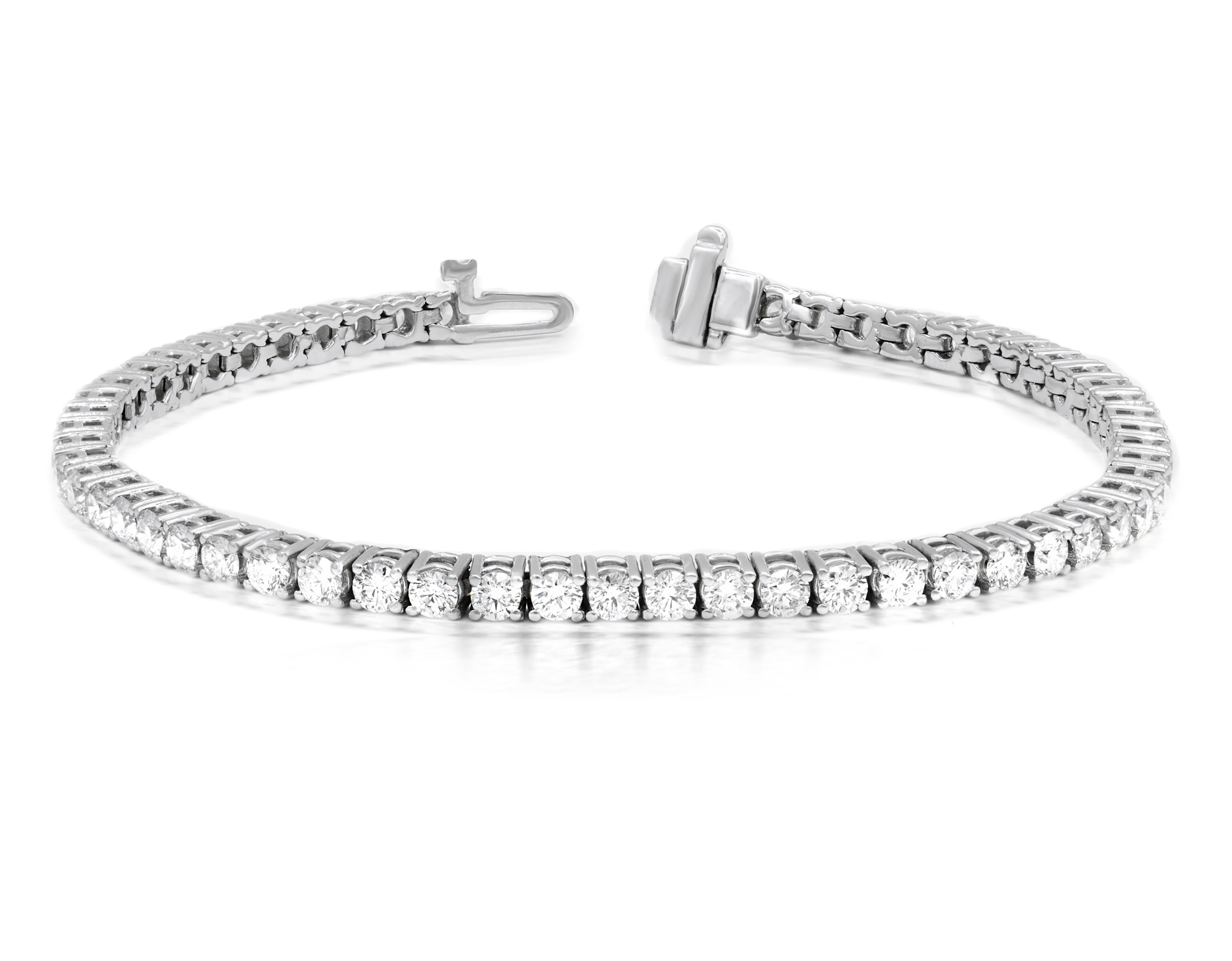 Timeless four prong diamond tennis bracelet:
- 3.00 Carats of Round Brilliant Cut Diamonds
- G-H in Color, SI I in Clarity
- 100% eye clean diamonds
