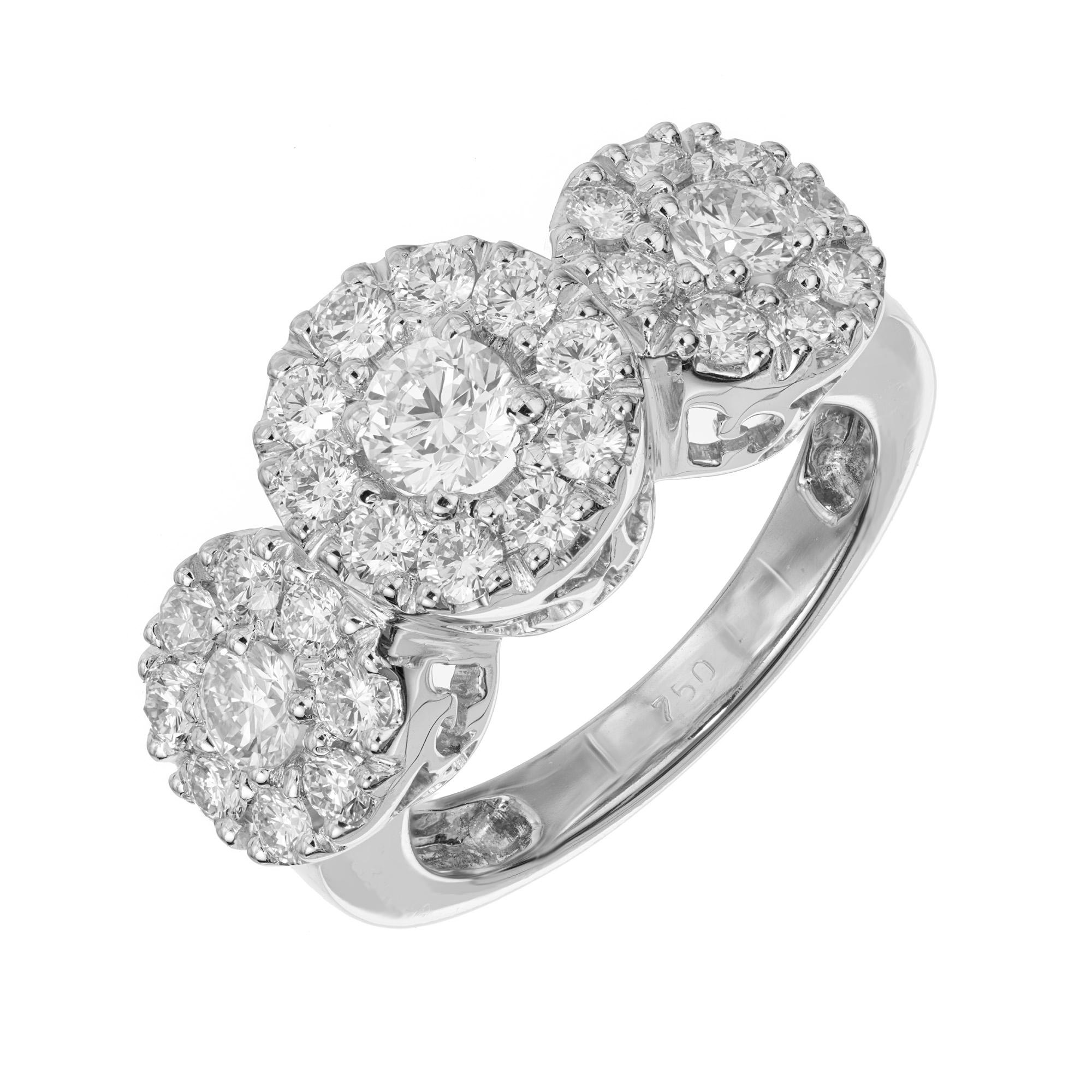 Substantial diamond halo engagement ring. This stunning three section diamond cluster ring consist of 1 round brilliant cut .50cts. diamond center stone accented with 2 round brilliant cut side diamonds totaling .50cts. Set in 18k white gold. Each