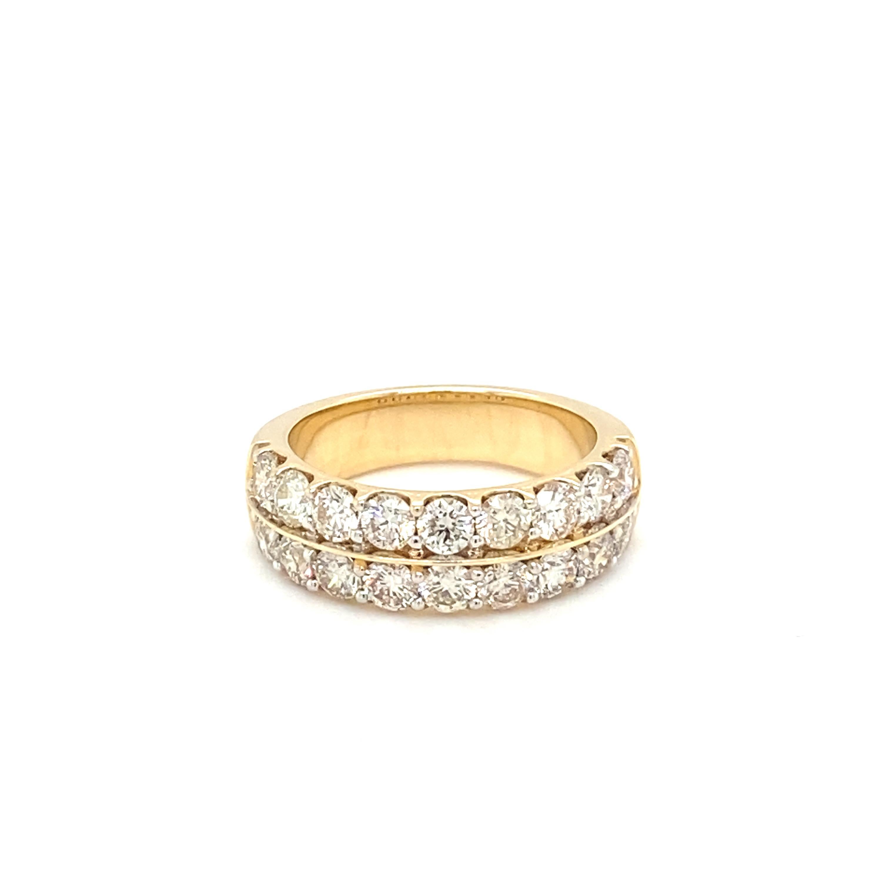 This beautiful band showcases double row pave setting of brilliant cut white diamonds. Timeless band features halfway diamond with classic shared prong. 
Diamond: 3.00 carat White
Gold: 14K Yellow 
Size: 7 Resizable
