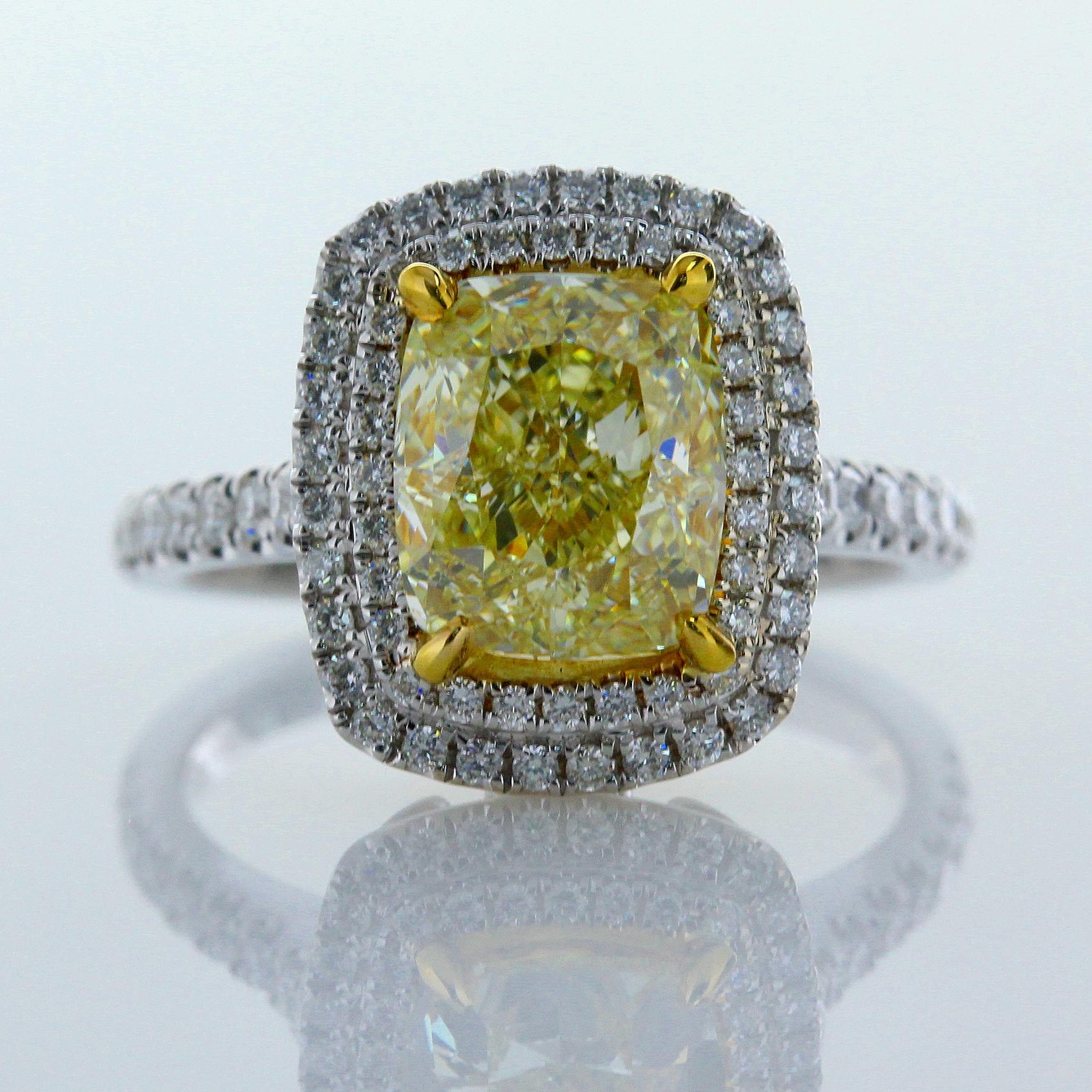 3.00 Carat Cushion Shape Natural Fancy Yellow Color Diamond VS1 Clarity 18 Karat White Gold Reversible Ring/Pendant. Measurements 8.59x7.38x5.22. 
Total Carat Weight on the ring is 3.60. 

This Ring converts into pendant with classic style