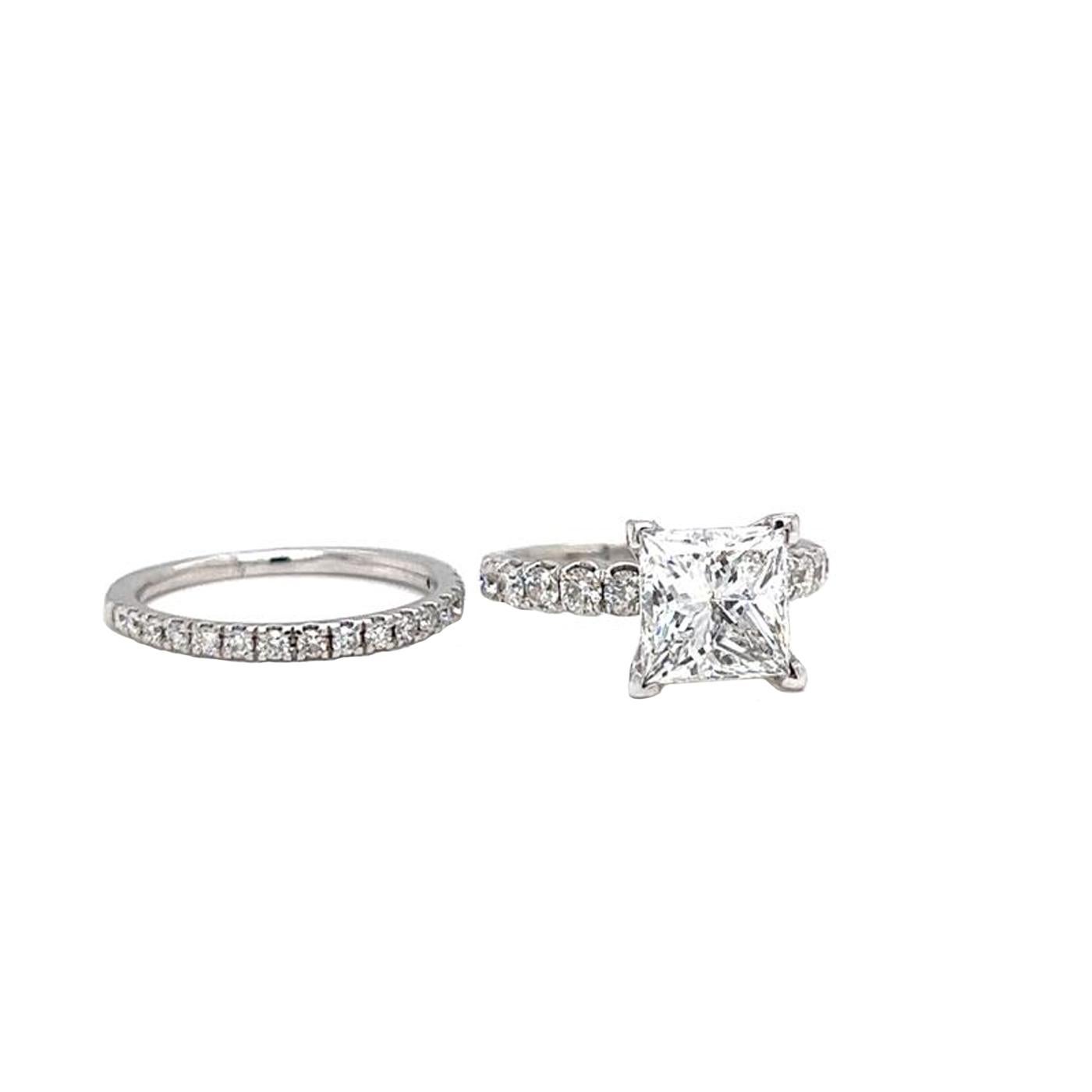 This stunning GIA Graded 3395781882 princess diamond wedding ring is sure to wow. With a total carat weight of 3.00ctw, this ring features princess-cut diamonds that create a captivating and eye-catching design. The ring gives a luxurious and