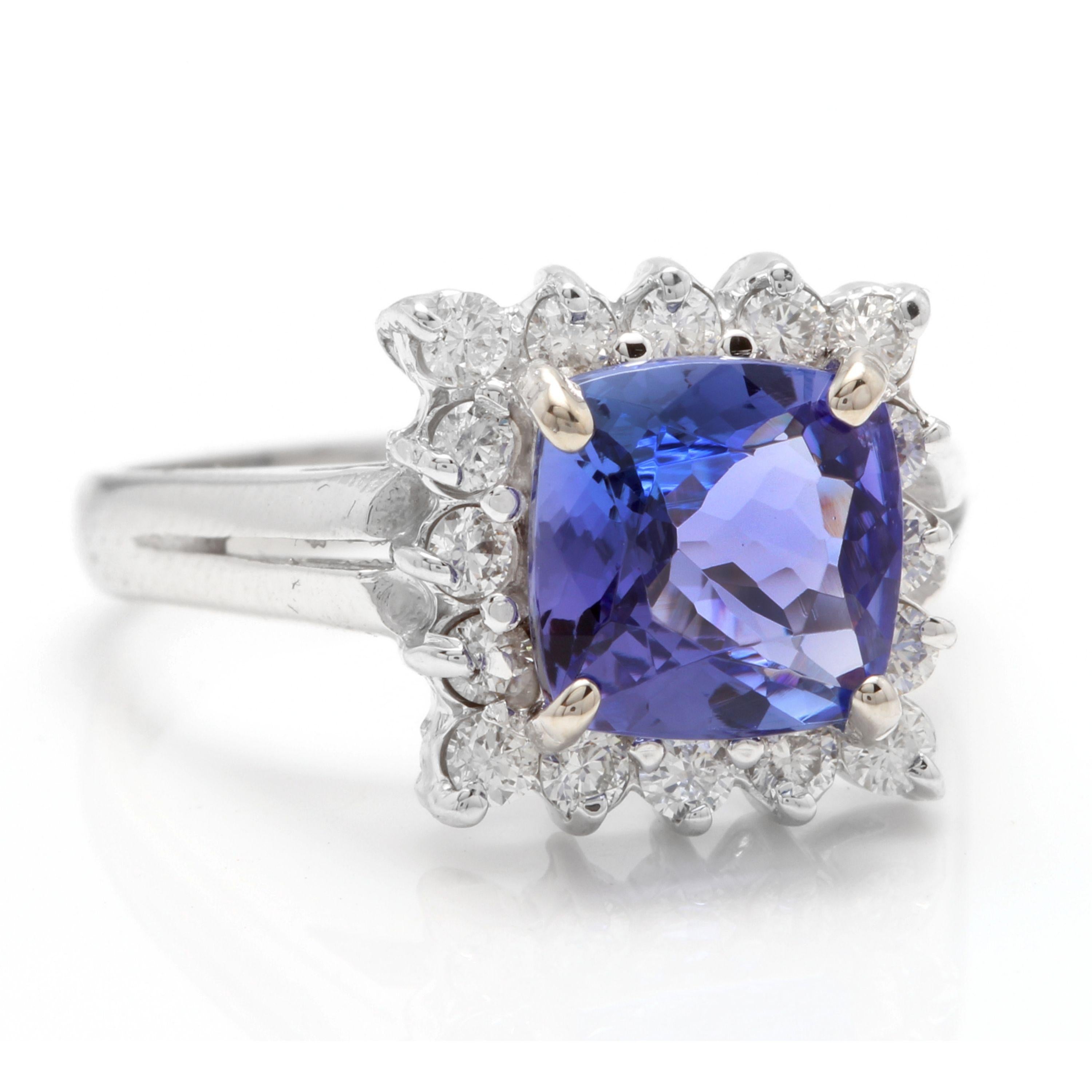 3.00 Carats Natural Very Nice Looking Tanzanite and Diamond 14K Solid White Gold Ring

Total Natural Cushion Cut Tanzanite Weight is: Approx. 2.50 Carats

Tanzanite Measures: 8.00 x 8.00mm

Natural Round Diamonds Weight: Approx. 0.50 Carats (color