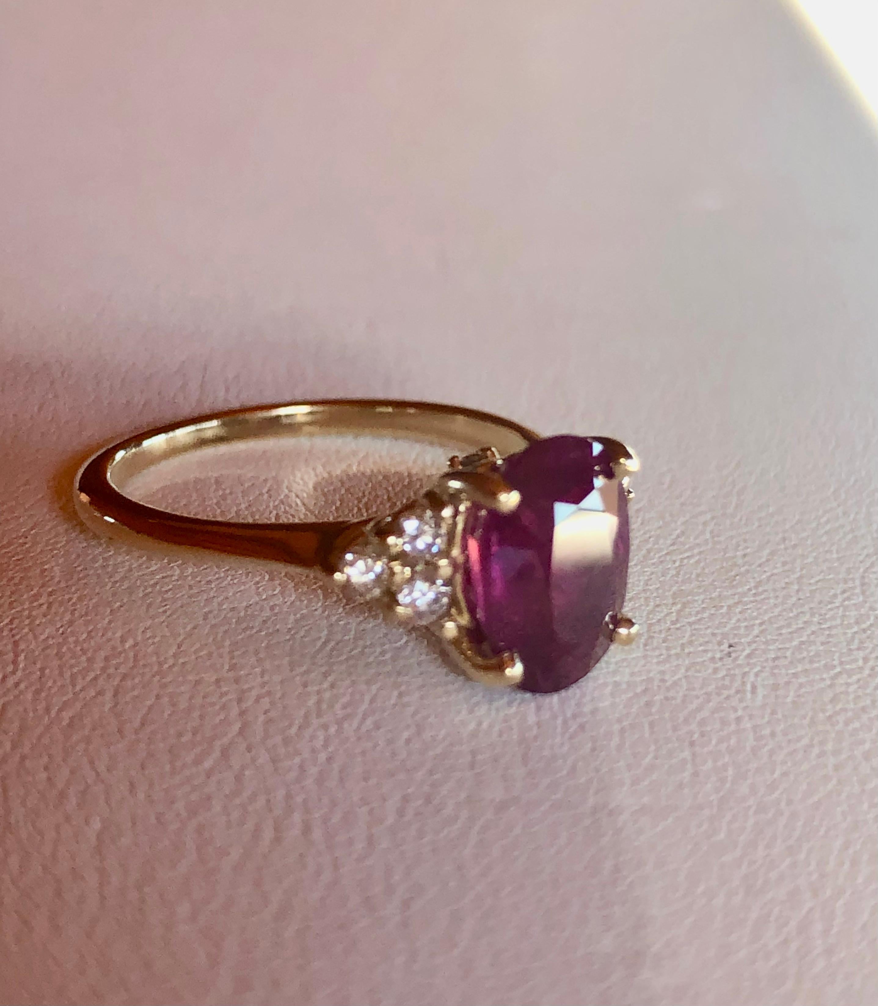 A classic cocktail ruby and diamond ring 14 karat yellow gold. This beautiful estate ring features a 3.0 carat ruby (Treated, heated, and filled)  at the center that is flanked by six round brilliant cut diamonds H/SI  weighing approximately .30