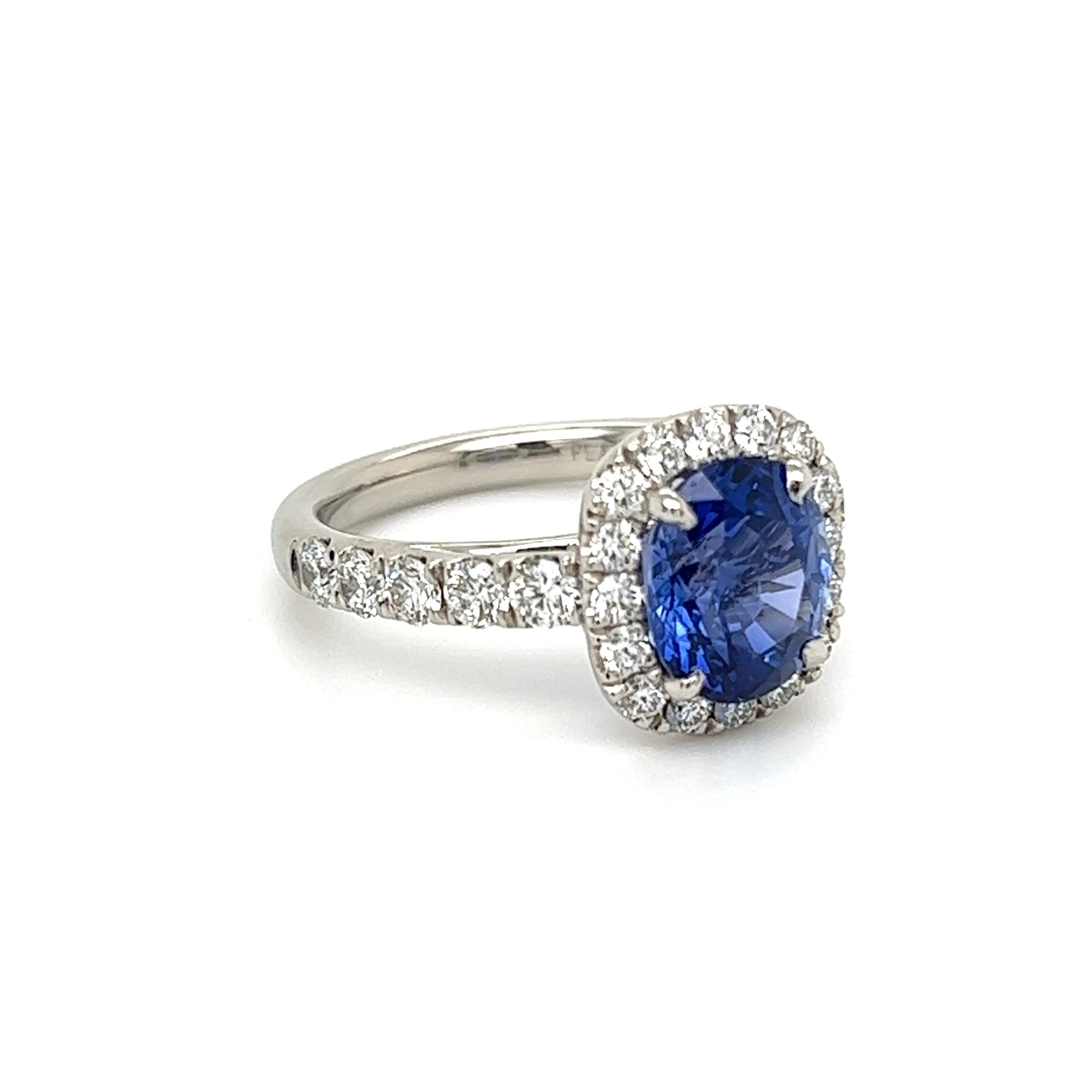 Simply Beautiful! Blue Sapphire and Diamond Platinum Henry Daussi Art Deco Revival Cocktail Ring. Centering a securely nestled Hand set Oval Sapphire weighing 3.00 Carat, measuring 8.96 x 7.60 x 5.30mm. Surrounded by Diamonds, weighing approx.