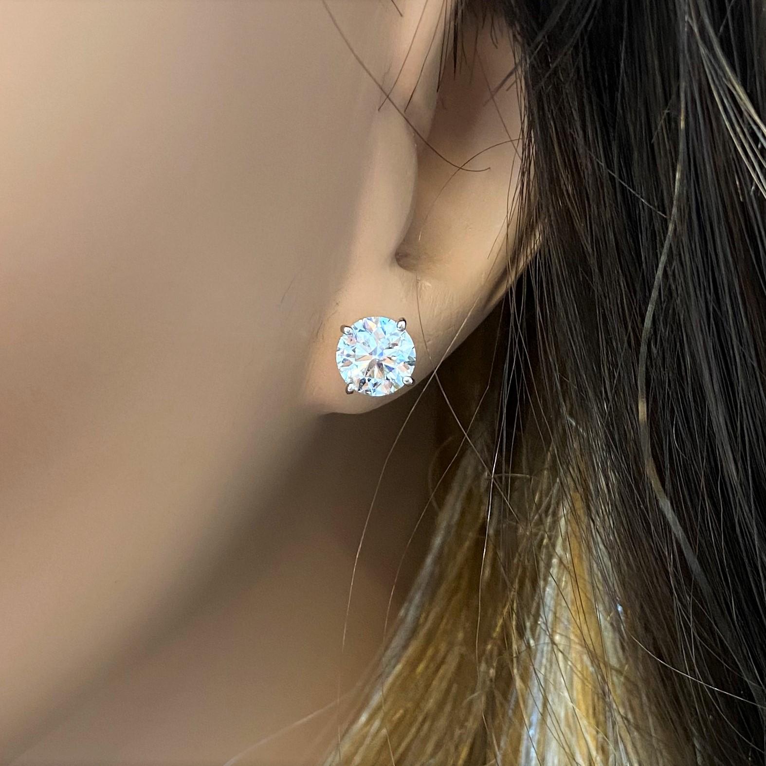 Stunning 14 Karat white gold handmade earrings featuring 2 round brilliant cut diamonds weighing 3.00cts total H-I color SI2 clarity. The stunning earrings measure 7.08mm in diameter, these gorgeous earrings are classic and timelessly elegant.
 Our
