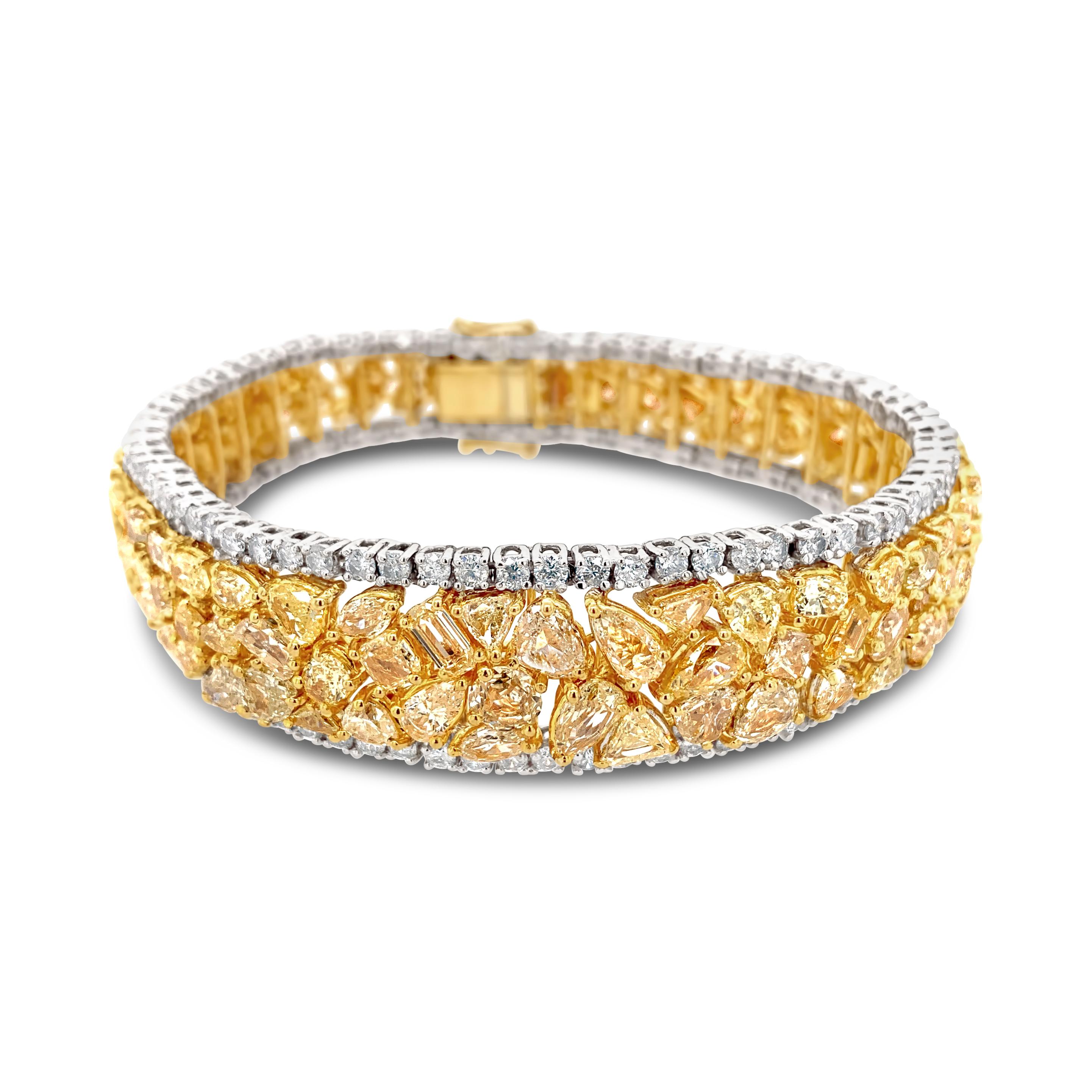 30.0 Carat (total weight) 18K Yellow & White Gold Diamond Bracelet, with fancy yellow diamonds and white diamonds on the border.  Diamond color G-H; clarity SI2.  Bracelet is 7 inches in length.
