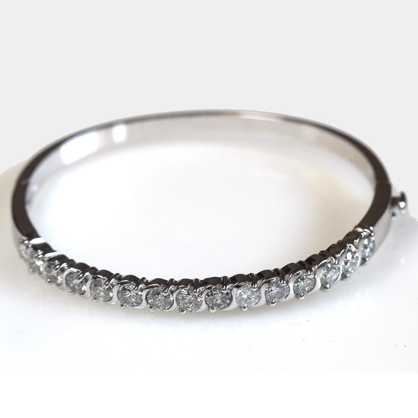 Will be made to order and take approximately 3-6 business weeks.

3.00 Carat Total Weight Platinum Hinged Bangle Bracelet

Diamond Details : 
Carat weight: 3.00 Carat Apprx
Shape: Round
Color: G-H
Clarity VS-SI

Side Diamond Details:
Color: