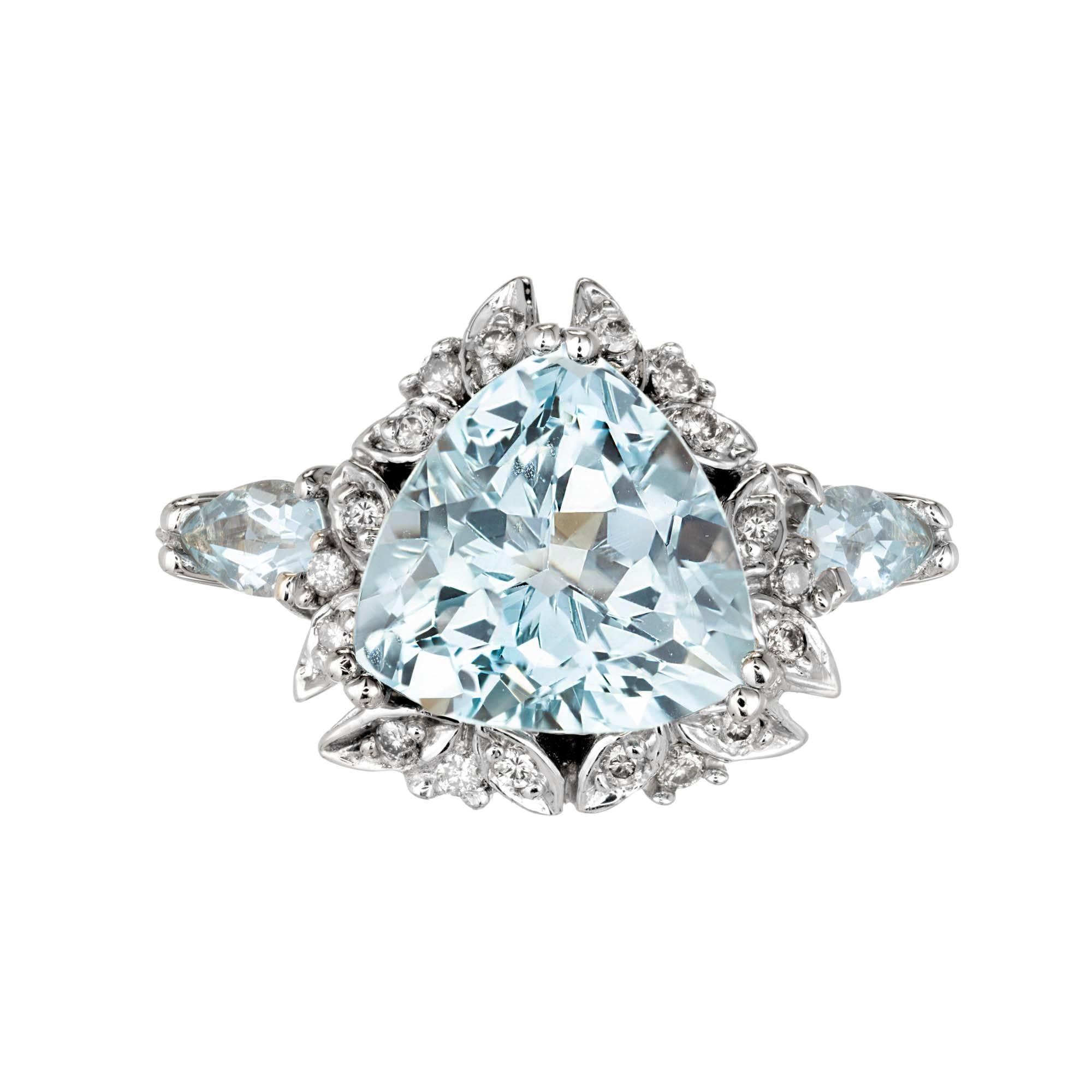 Aqua and diamond engagement ring. 14k white gold with a triangle cut center and pear sides with diamond accents.

1 triangle light blue VS aquamarine Approximate 3.00 total carat weight
2 pear light blue VS aquamarines Approximate .40 total carat