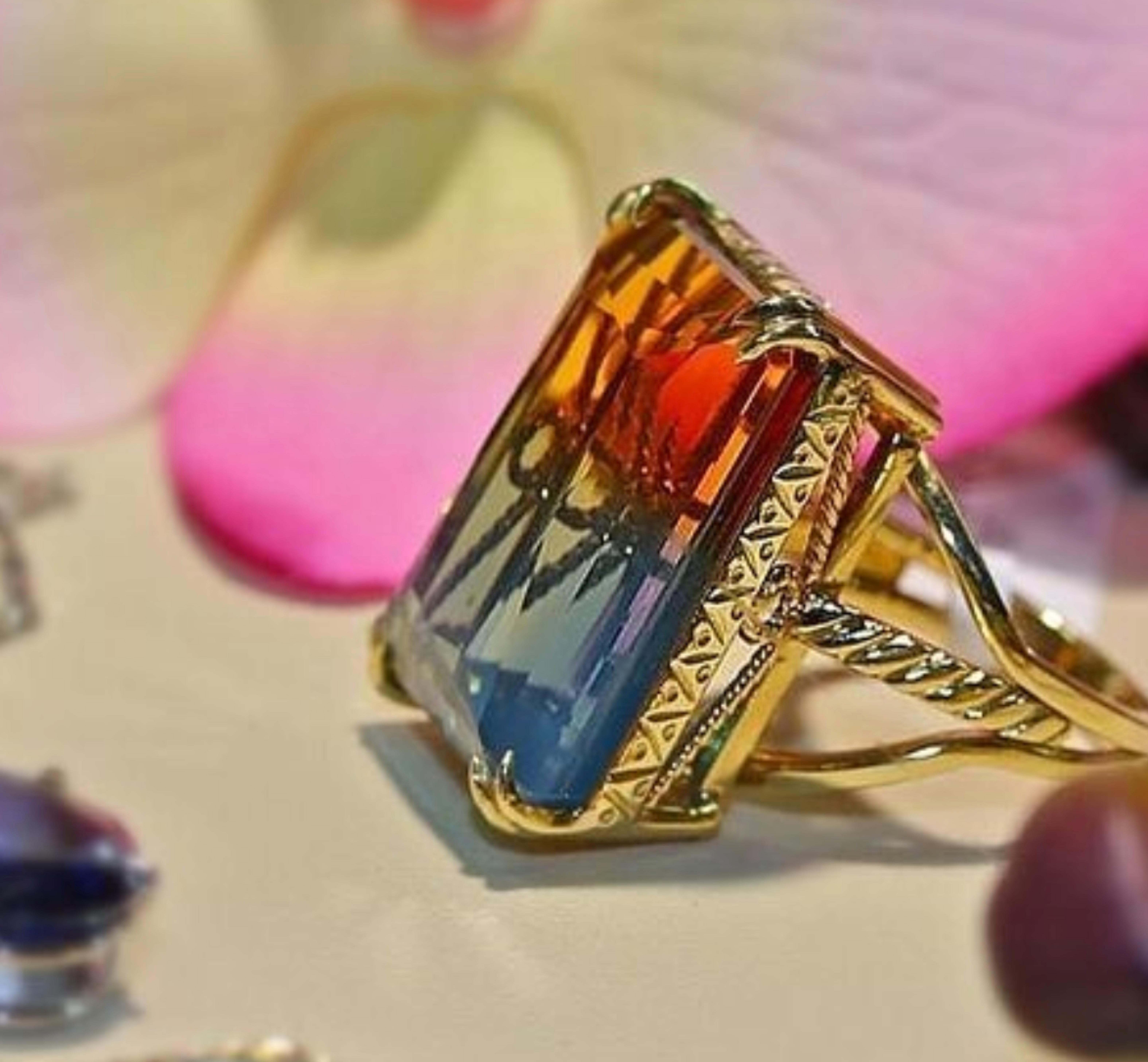 Emerald cut Ametrine Orange Blue Topaz.
The gorgeous ring is handcrafted in 14k yellow gold.
The stone is handset in prong setting.
The ring is size 7.
