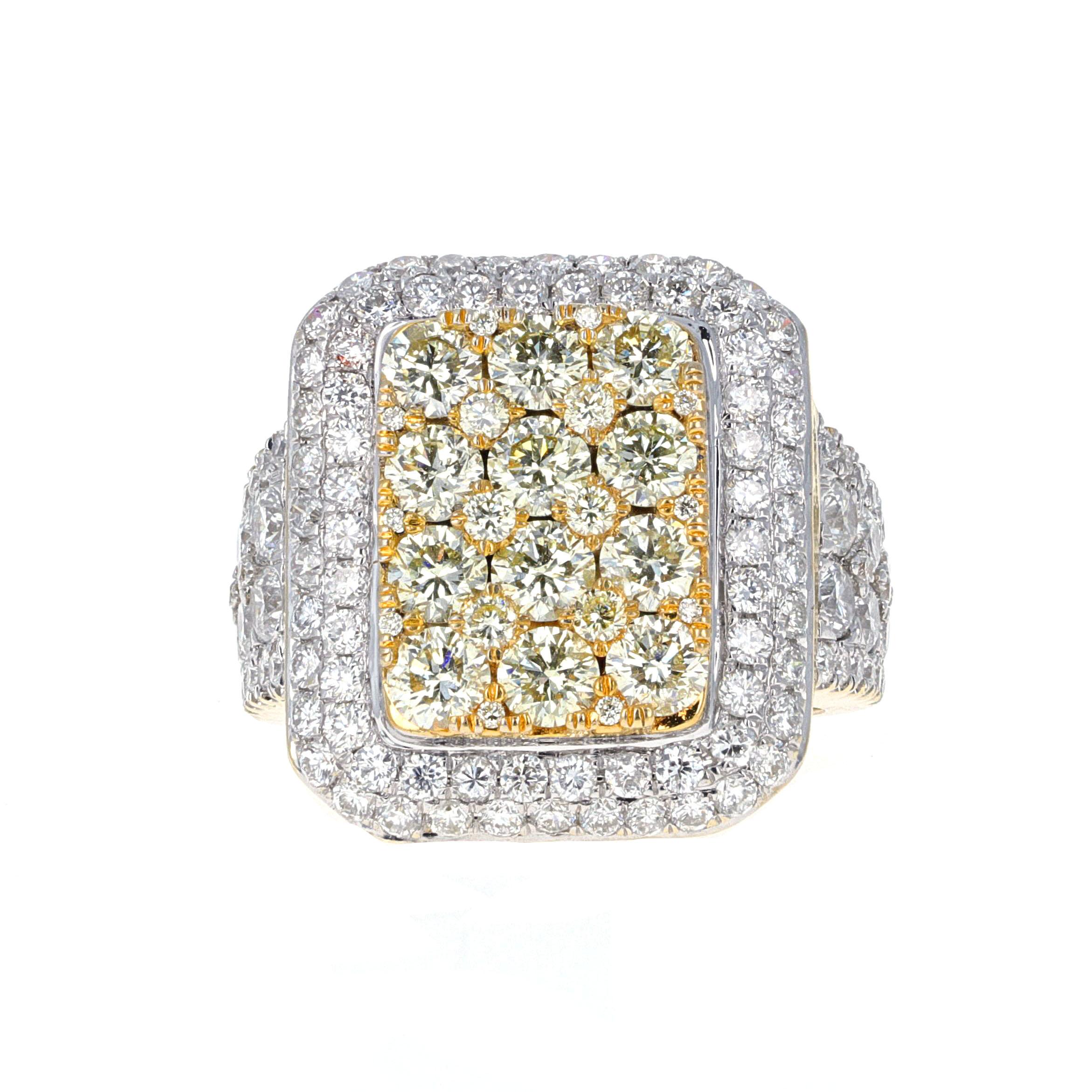18-karat yellow gold and white gold diamond ring. The ring has 128 round white brilliant diamonds weighing an estimated 3.00 carats in total. 12 round brilliant yellow diamonds weigh an estimated 2.00 carats total. 
The ring sparkles in every