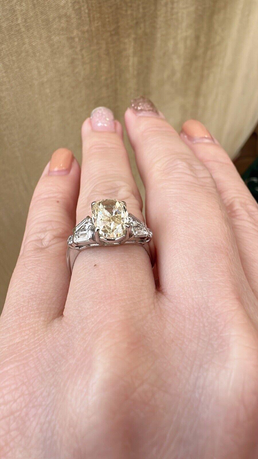 3.00 Carat Yellow Oval Diamond Ring with Baguette Round Accents in Platinum In Excellent Condition For Sale In La Jolla, CA
