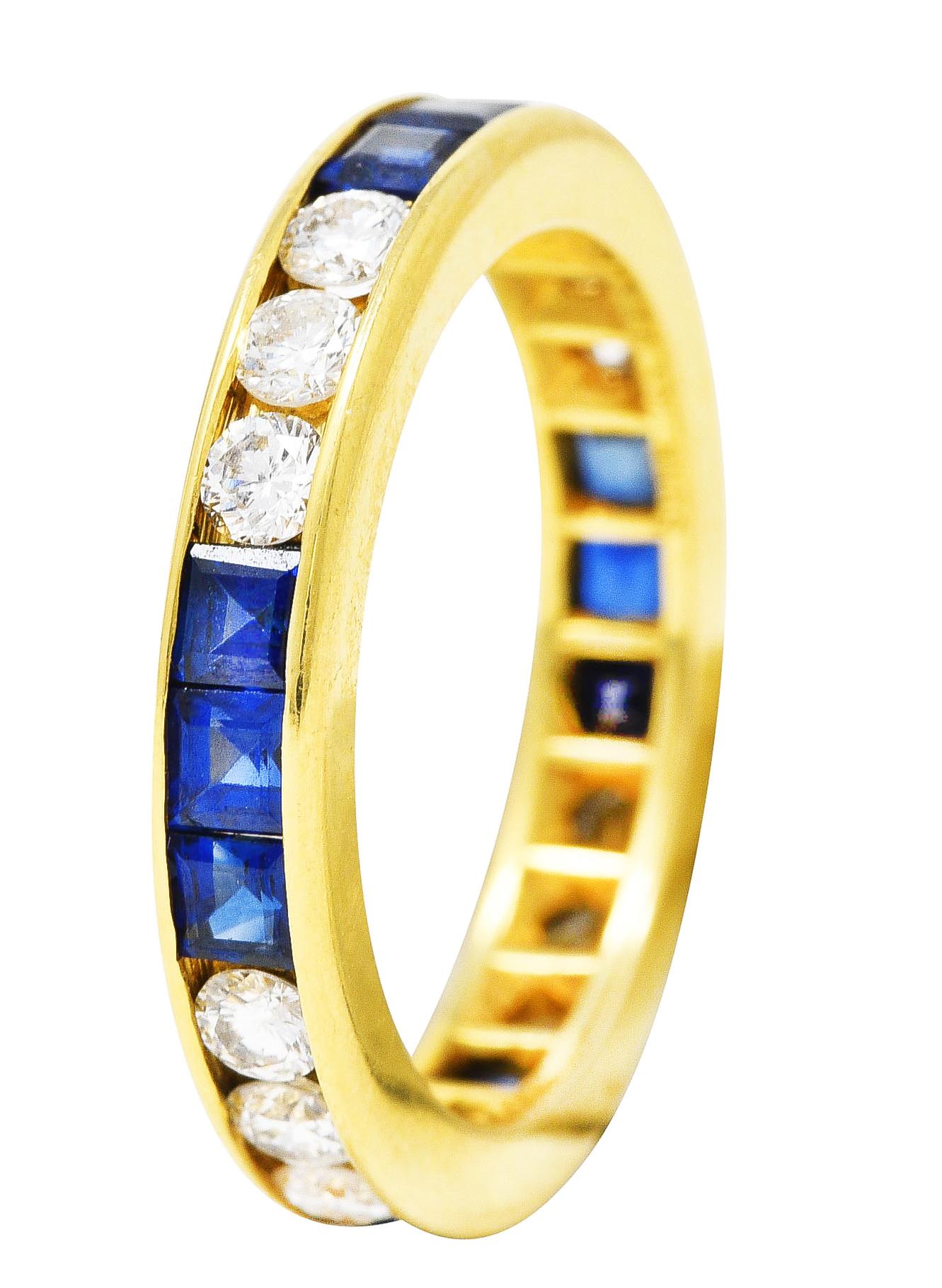 Band ring features round brilliant cut diamonds and square cut sapphires channel set fully around. Diamonds weigh approximately 1.20 carats total - G/H in color with VS2 clarity. Sapphires weigh approximately 1.80 carats total - transparent medium