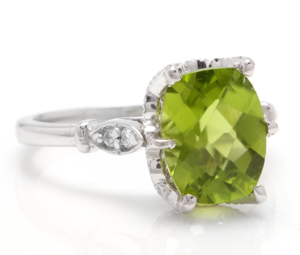3.00 Carats Impressive Natural Peridot and Diamond 14K White Gold Ring

Total Natural Peridot Weight is: Approx. 2.92 Carats

Peridot Measures: Approx. 10.00 x 8.00mm

Natural Round Diamonds Weight: Approx. 0.08 Carats (color G-H / Clarity