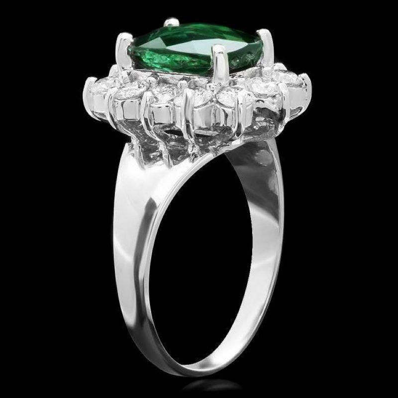 3.00 Carats Natural Green Tourmaline and Diamond 14K Solid White Gold Ring

Total Natural Tourmaline Weight is: Approx. 2.90 Carats 

Tourmaline Measures: Approx. 10.00 x 7.00mm

Natural Round Diamonds Weight: 1.00 Carats (color G-H / Clarity
