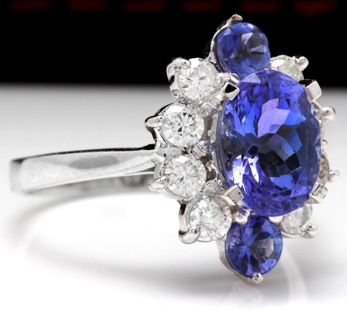 3.00 Carats Natural Very Nice Looking Tanzanite and Diamond 14K Solid White Gold Ring

Total Natural Oval Cut Tanzanite Weight is: Approx. 2.25 Carats

Tanzanite Measures: Approx. 9.12 x 6.80mm

Tanzanite Treatment: Heat

Natural Round Diamonds
