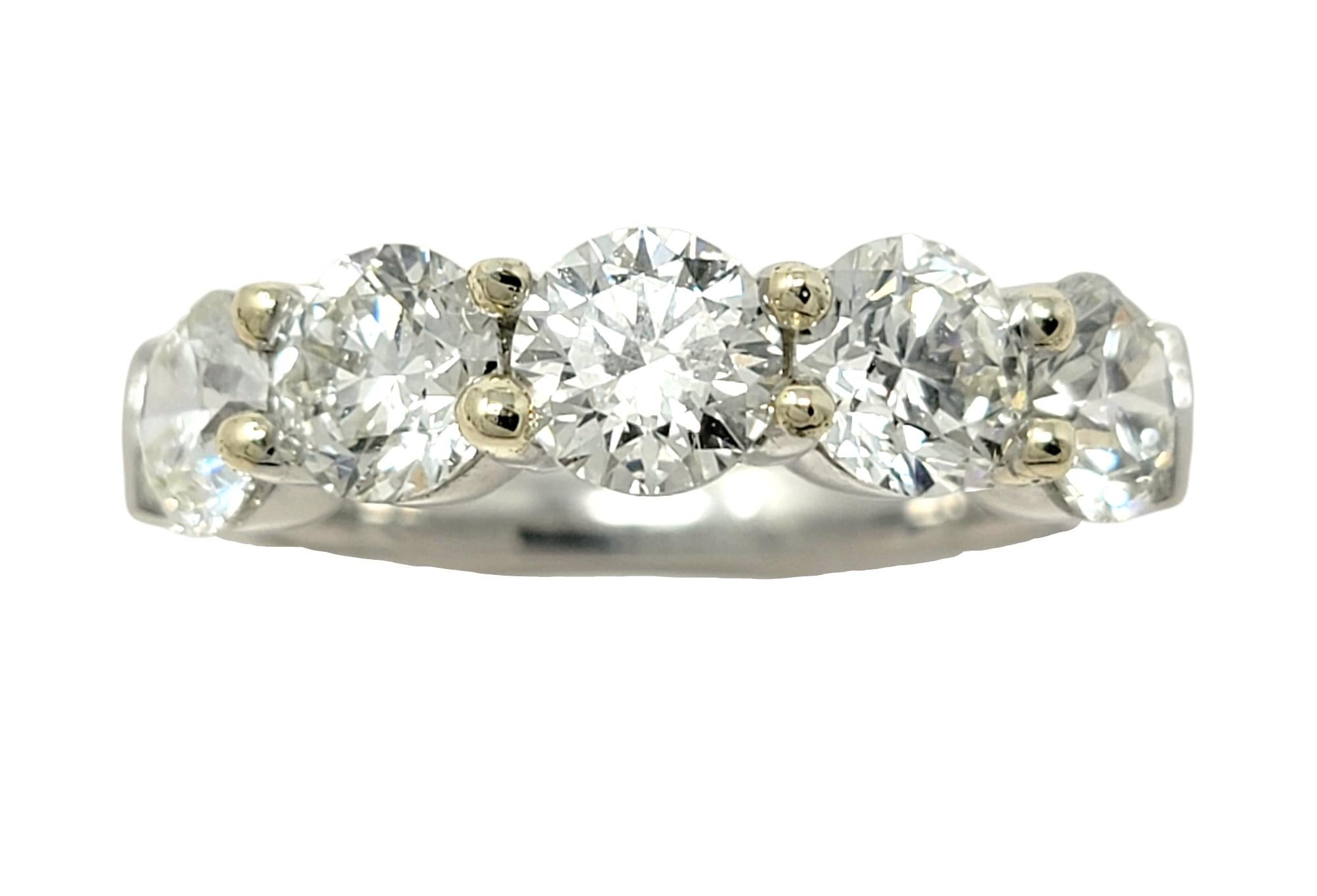 Ring size: 7

Stunningly sparkly diamond and platinum semi-eternity band ring. This timeless beauty features 5 sizeable icy white round diamonds prong set in platinum with yellow gold tips along the top half of the ring. The natural stones are