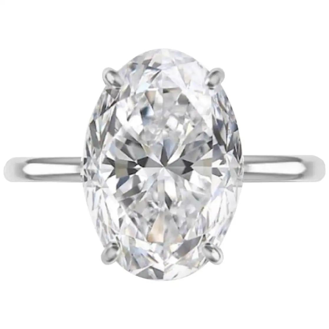  3 Carat exquisite oval-shaped diamond ring that epitomizes timeless elegance and unparalleled beauty. Crafted to perfection, this stunning piece boasts exceptional luster, accentuated by its excellent cut and polish.

With a remarkable ratio of
