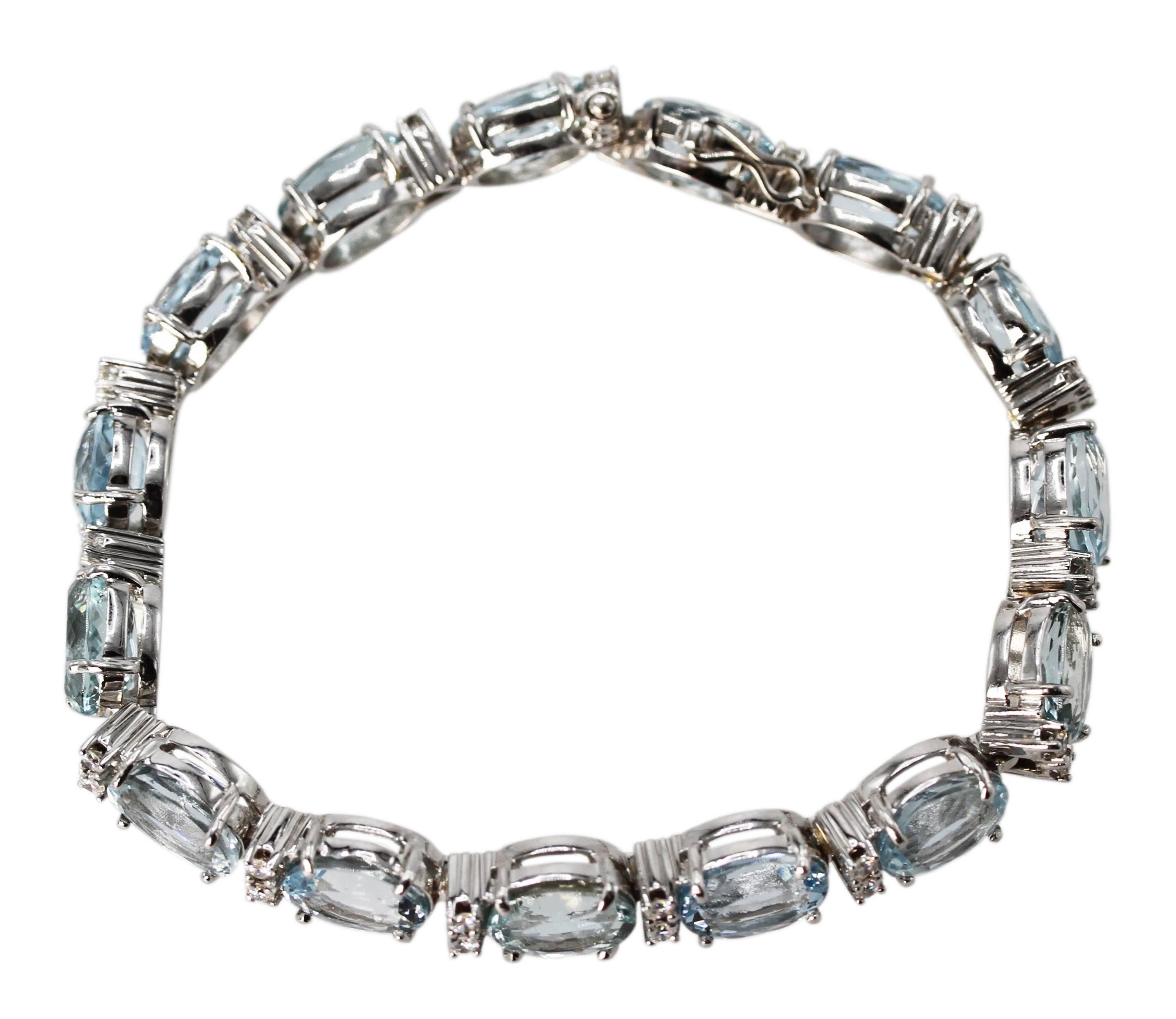 18 Karat White Gold, Aquamarine and Diamond Straight Line Bracelet
• Stamped 750
• 15 oval aquamarines weighing approximately 30.00 carats
• 30 round diamonds weighing approximately 1.00 carat
• Length 7 1/4 inches, width 1/4 inch, gross weight 29.3