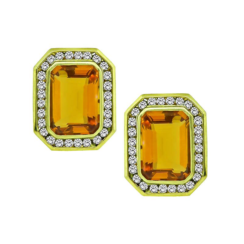This is a gorgeous 18k yellow gold pendant and earrings set. The set features lovely emerald cut citrines that weigh approximately 30.00ct. The citrines are accentuated by sparkling round cut diamonds that weigh approximately 3.00ct. The color of