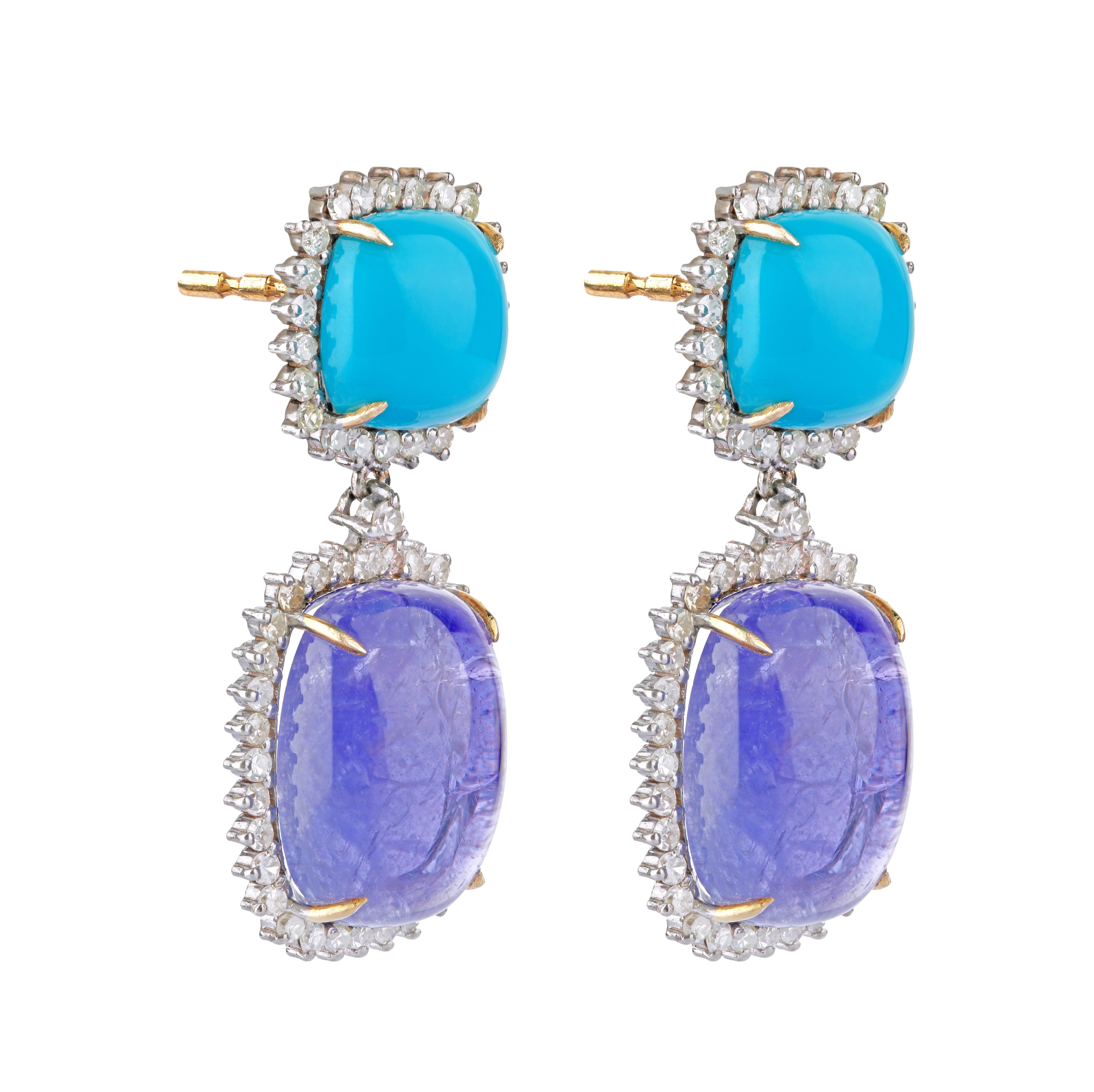 30.07 Carats Diamond, Tanzanite, and Turquoise Dangle Earrings in Modern Style

Perfection speaks for itself. For it, does not have a language but a form. A form that is clearly portrayed in this pair of earrings. This scintillating set of earrings