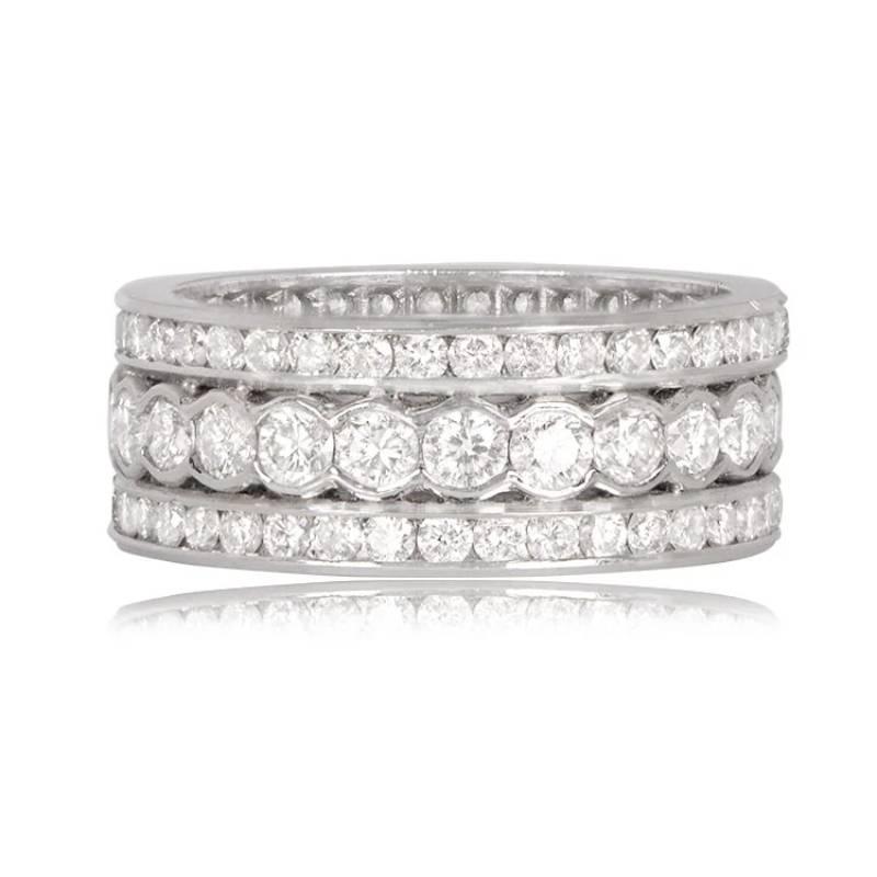 An exquisite platinum band featuring a central row of round diamonds set in fine platinum half-bezels, flanked by rows of high-quality full-cut channel-set diamonds on each side. The brilliant-cut diamonds boast an approximate H color and VS