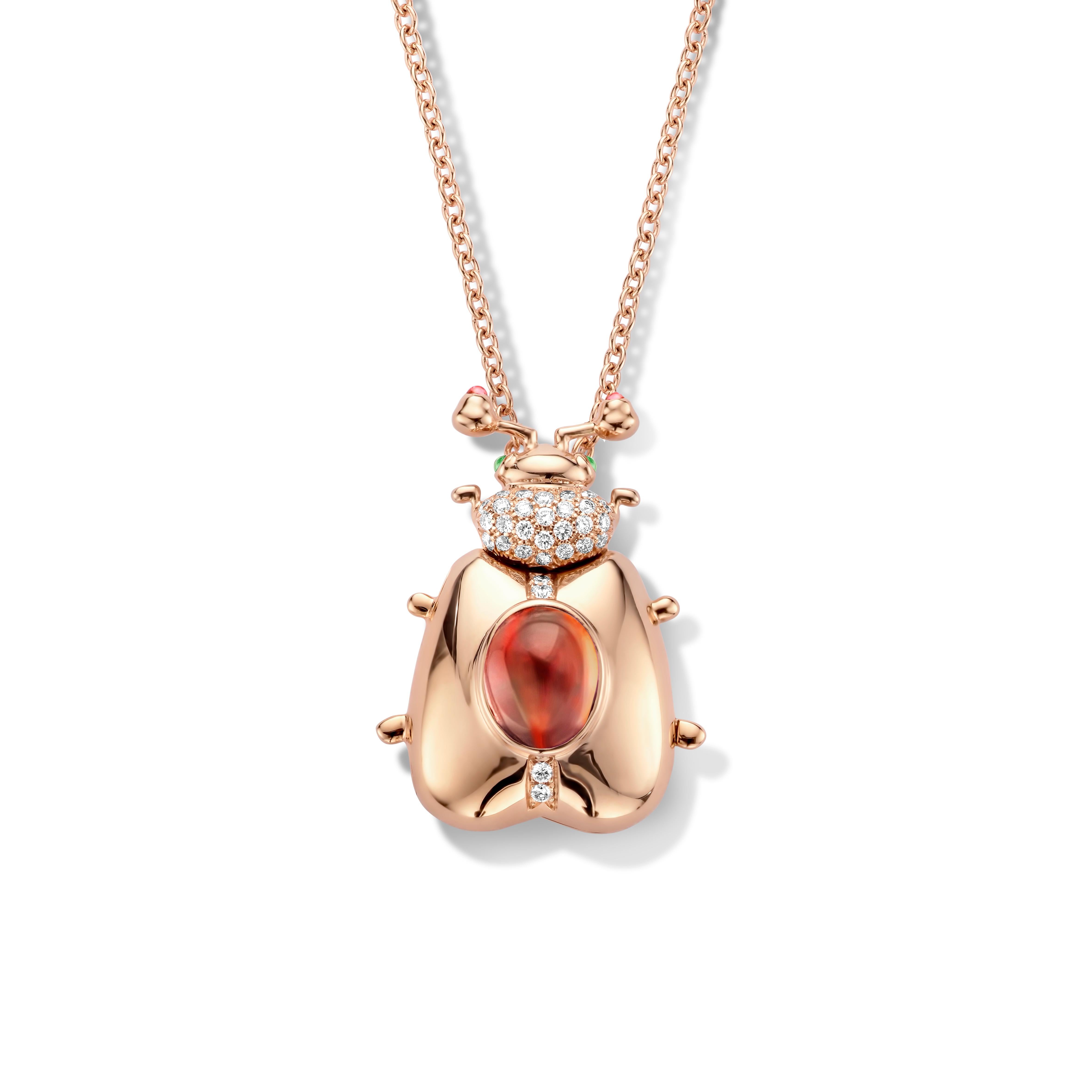 One of a kind lucky beetle necklace in 18 Karat rose gold 16g set with the finest diamonds in brilliant cut 0,31Ct (VVS/DEF quality) and one natural, mandarin garnet in oval cabochon cut 3,00Ct. 

The feelers and the eyes of this adorable Goldbeetle