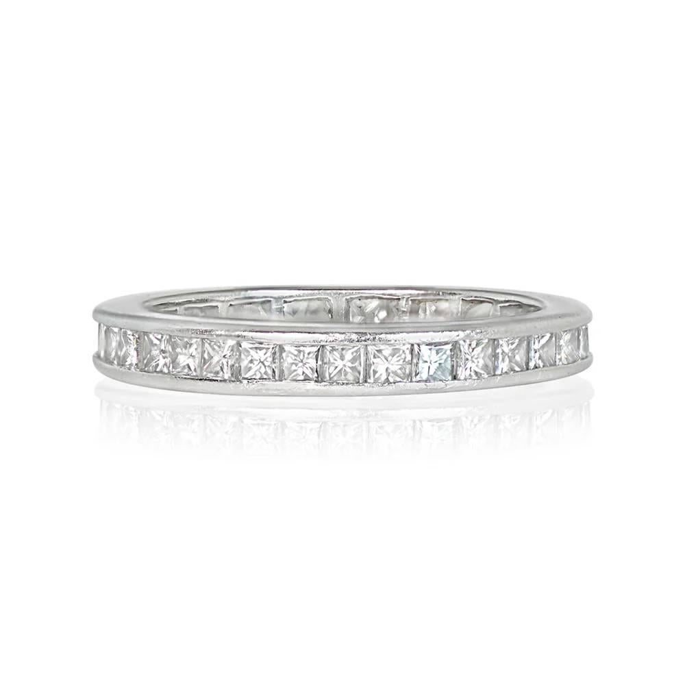 Indulge in luxury with this platinum eternity band, channel-set with approximately 3.00 carats of princess-cut diamonds. The diamonds exhibit a stunning H color and boast VS1-VS2 clarity overall. With a width of 2.95mm, this band combines timeless