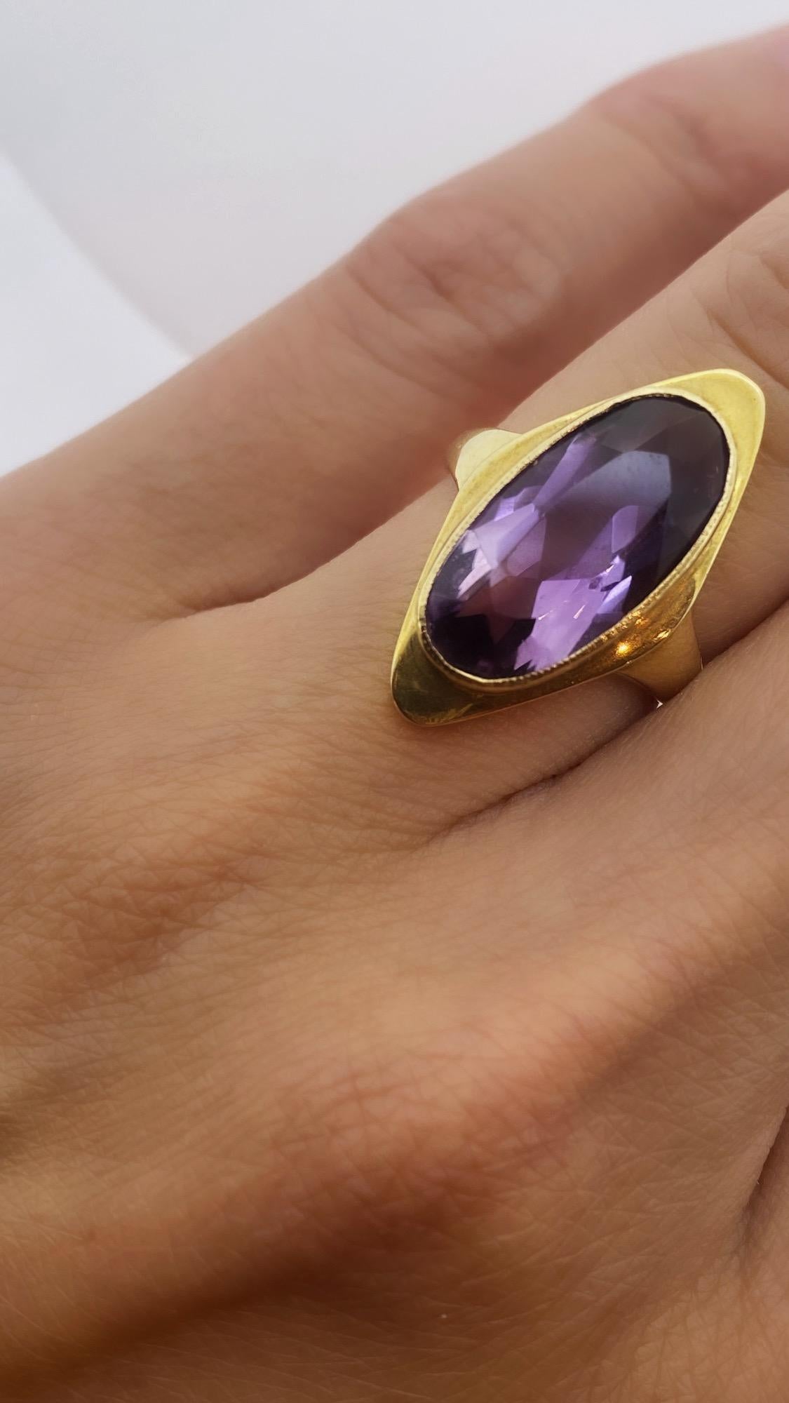 Inspired by Arts & Crafts Movement, 
this elegant ring is of unusual tonneau shape, 
looking fantastic on! 


Centering an oval Natural Amethyst 
of vivid Royal Purple colour & excellent clarity, 
measuring 16mm x 8mmm - 3.00ct approx. 

Encased in