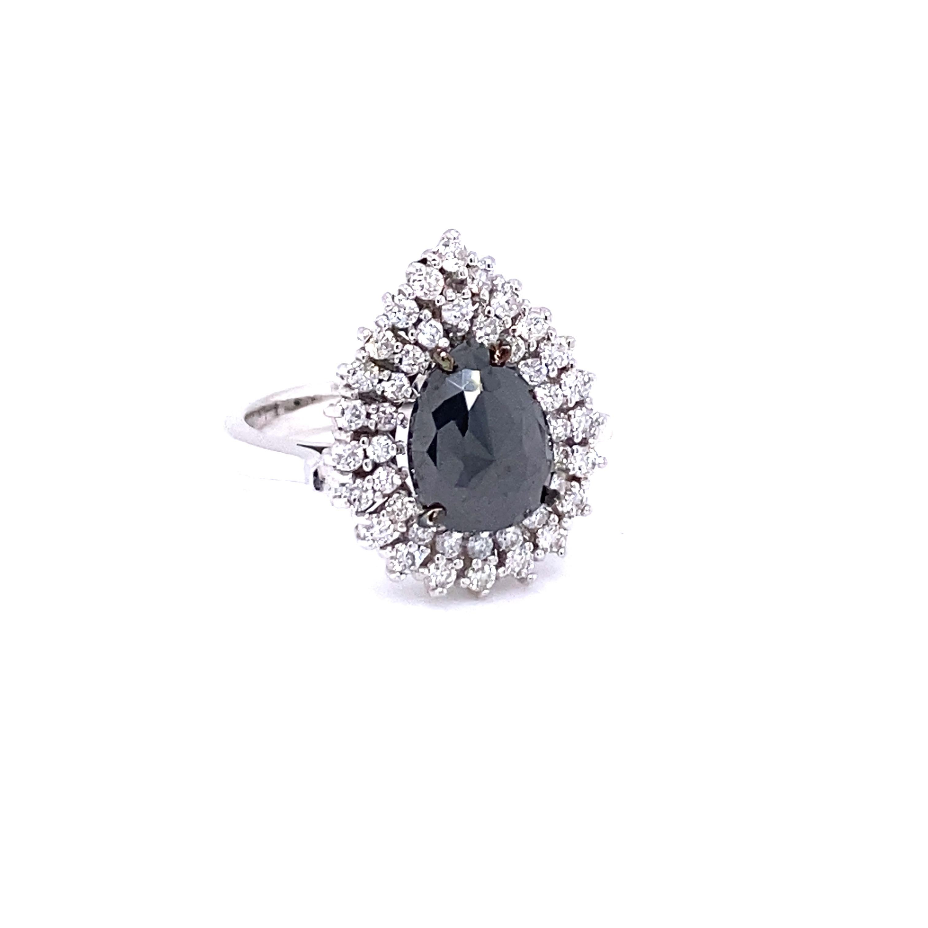 Stunning Pear Cut Black and White Diamond  Bridal Ring
Description as follows:

Pear Cut Dia weighs 2.32 carats
43 Round Cut Diamonds weigh 0.69 carats (Clarity: SI, Color: F)
14 Karat White Gold approximately 5.3 grams
Ring Size: 7 (complimentary