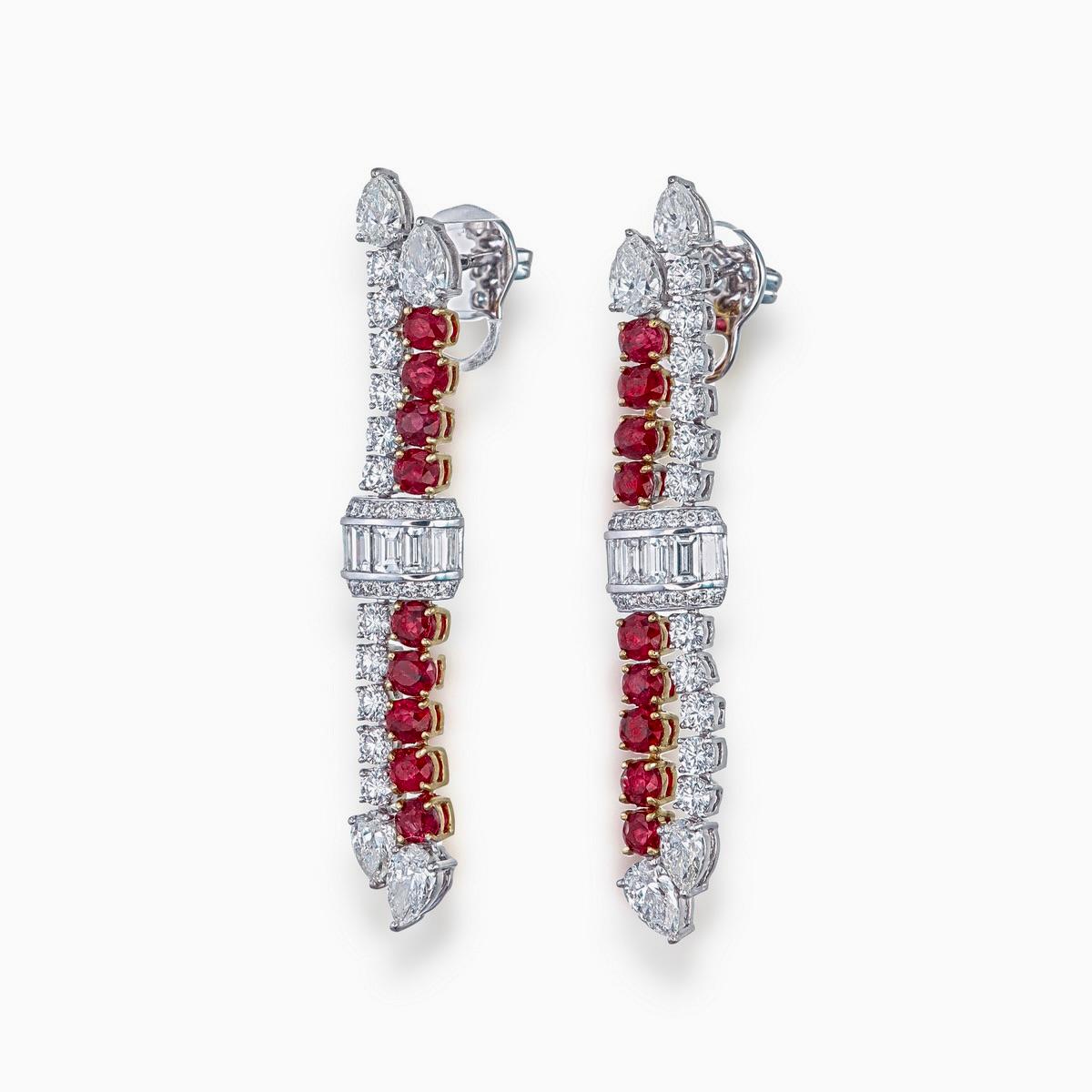 A pair of unique ruby and diamond earrings featured by Rewa jewels made in 18 karat white gold.

It has a beautiful combination of eighteen natural Burmese rubies without any treatment weighing approximately 3.01 carat.

The rubies are surrounded by