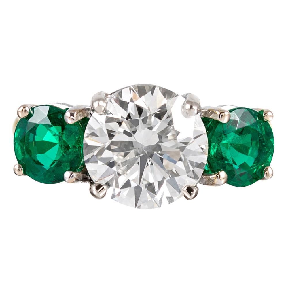 3.01 Carat Diamond and Emerald Three-Stone Ring