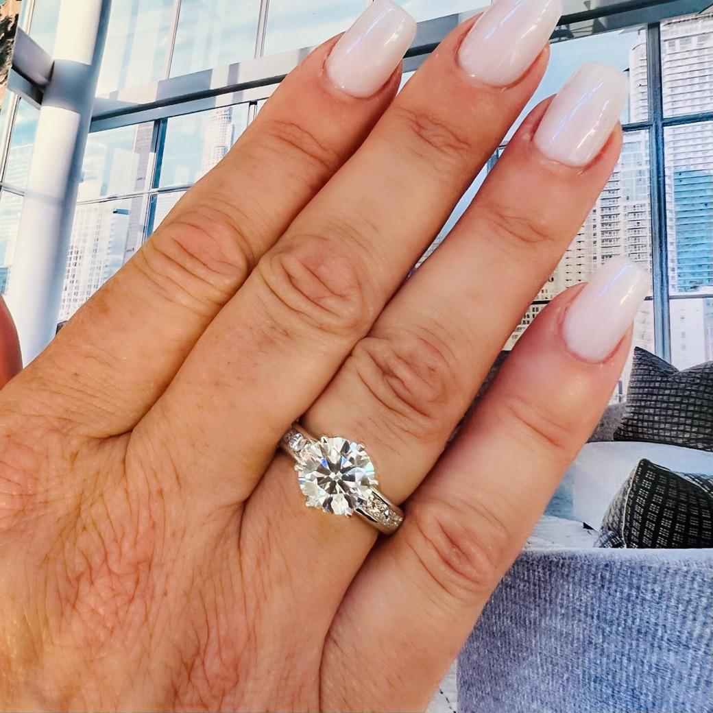 From one of the most respected design houses in the world comes this absolutely stunning Tiffany & Co engagement ring. Featuring a phenomenal 3.01 carat round brilliant cut natural diamond as its centerpiece, this classic platinum Tiffany engagement