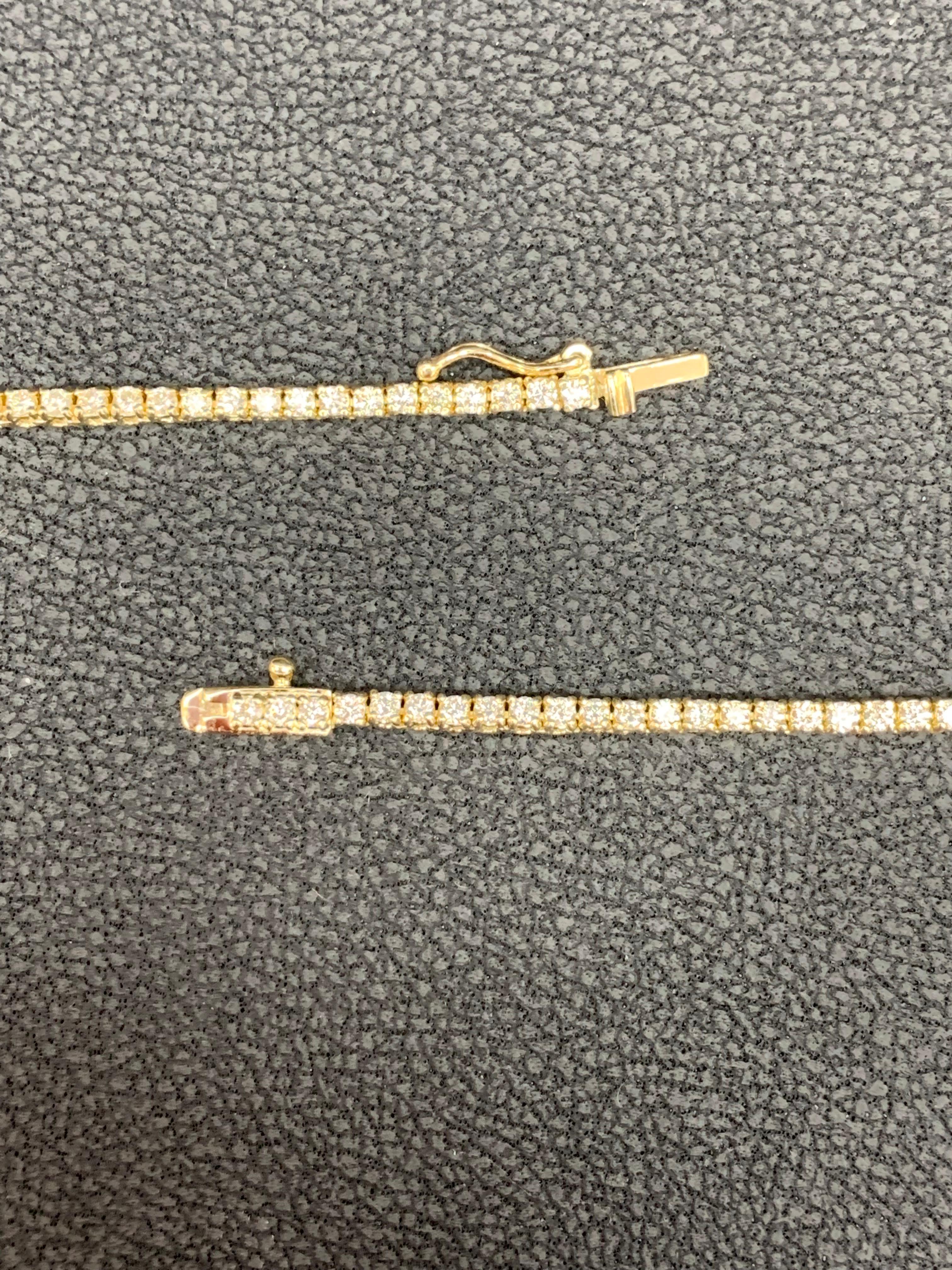A brilliant and classic piece showcasing a line of round diamonds set in 14K Yellow Gold. All the diamonds in this necklace are brilliant round cut and weigh 3.01 carats total. 16 inches in length.