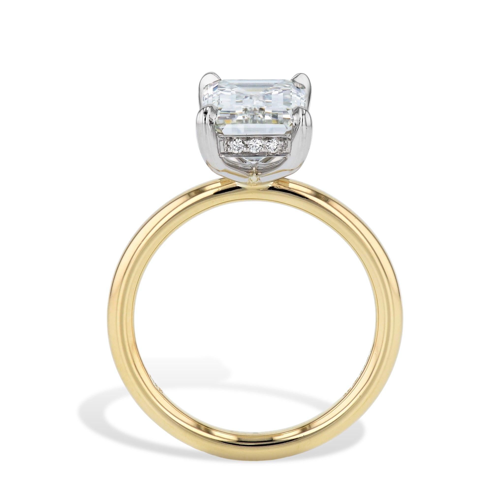 Elevate your engagement proposal with this breathtaking Emerald Cut Diamond Engagement Ring. Featuring a stunning 3.01 carat emerald cut center diamond set in a 4 prong platinum head, and surrounded by 18 pieces of pave diamonds underneath the