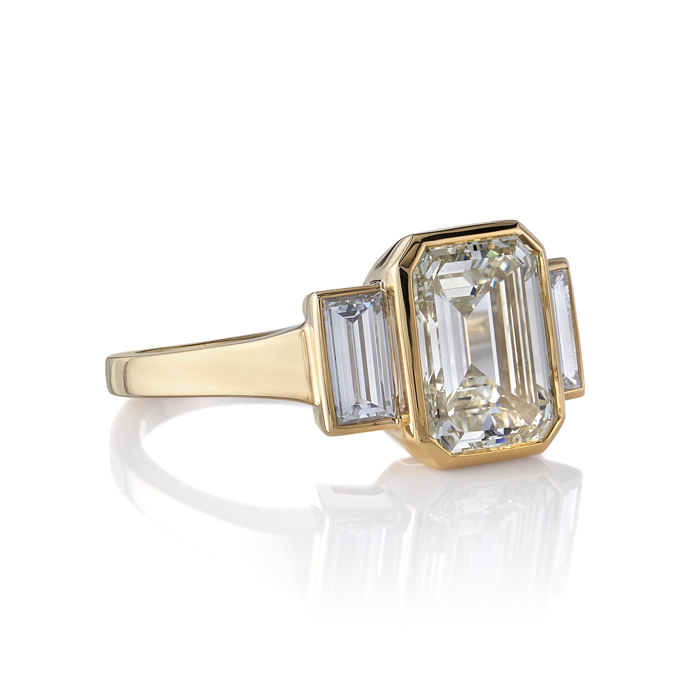 3.01ct U-V/VVS2 GIA certified Emerald cut diamond with 0.66ctw Baguette cut accent diamonds set in a handcrafted 18K yellow gold mounting.

Ring is currently a size 6 and can be sized to fit.

Our jewelry is made locally in Los Angeles and most