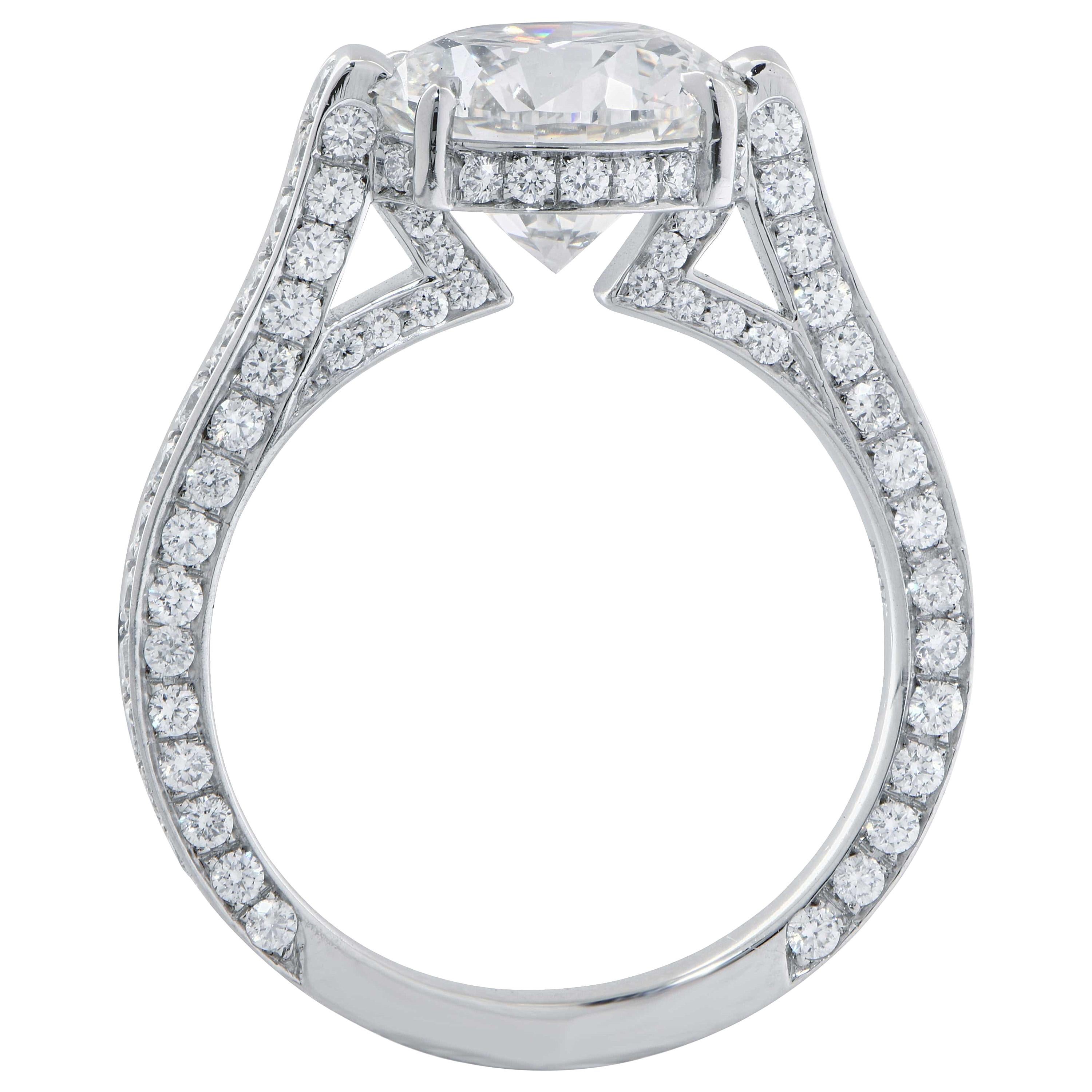 Regent Jewelers' platinum engagement ring features a round brilliant cut diamond weighing 3.01 carats GIA graded F color VS2 clarity. The ring is adorned by 128 round brilliant cut diamonds with a total weight of 1.07 carats with F color and VS