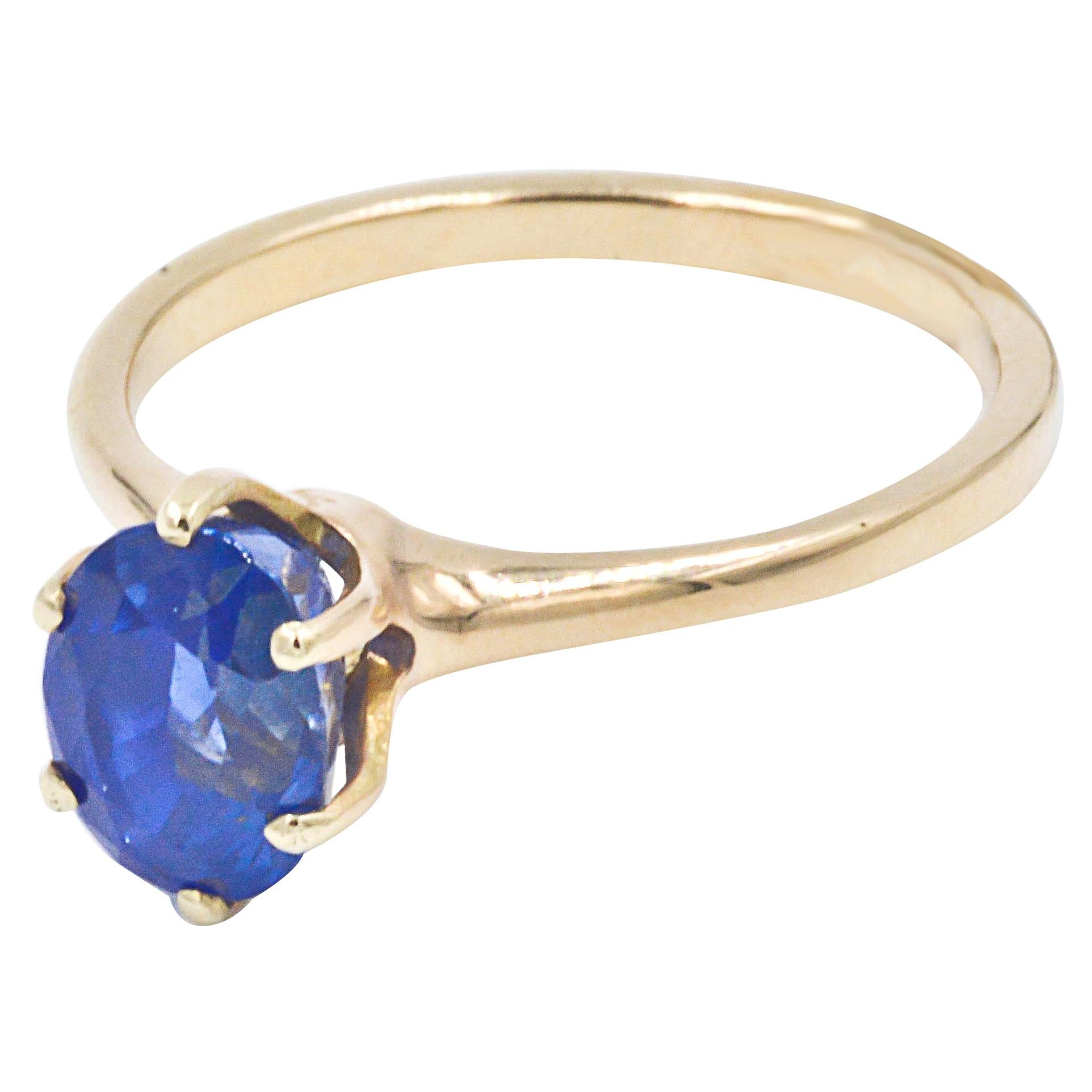 3.01 Carat Oval Blue Sapphire 14 Karat Yellow Gold Ring