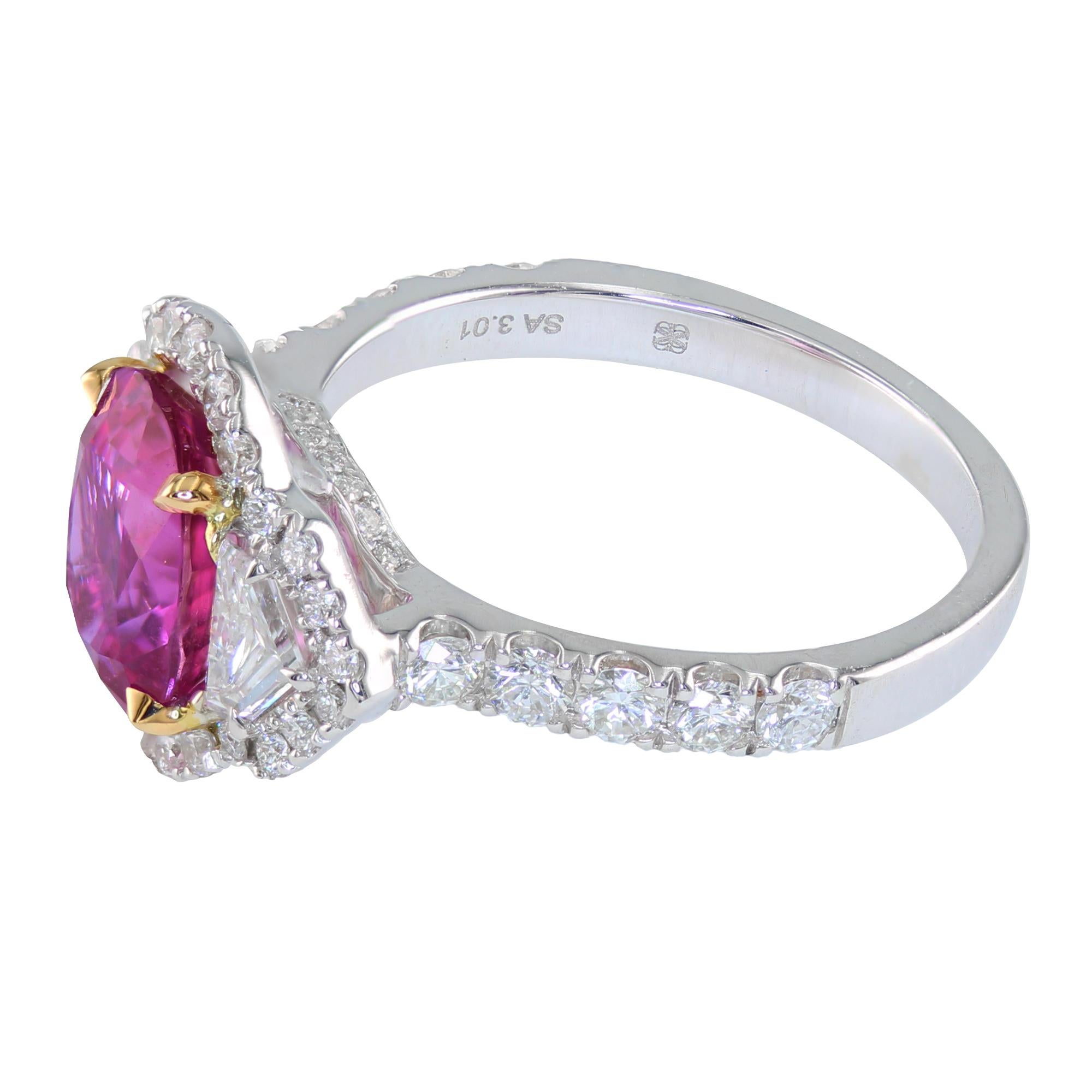 3.01 carat Oval Pink Sapphire, complimented by 0.34 carat epaulet diamonds, surrounded by 0.74 carat round diamonds. 

Pretty in pink classy three-stone-ring, for the perfect one-of-a-kind colored gemstone engagement.
May also be worn as a beautiful