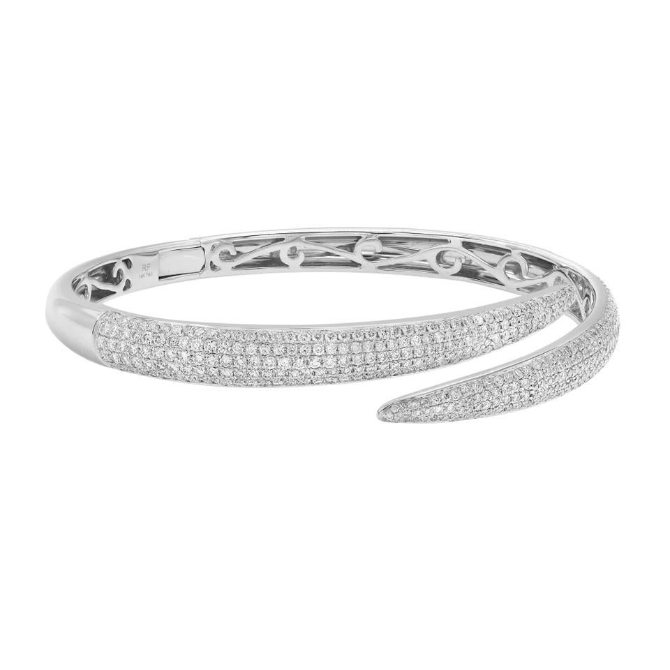 Introducing our stunning 3.01 Carat Pave Set Round Cut Diamond Bangle Bracelet in 18K White Gold. This exquisite bracelet showcases five rows of dazzling round brilliant diamonds, meticulously set in a captivating pave style. The diamonds are