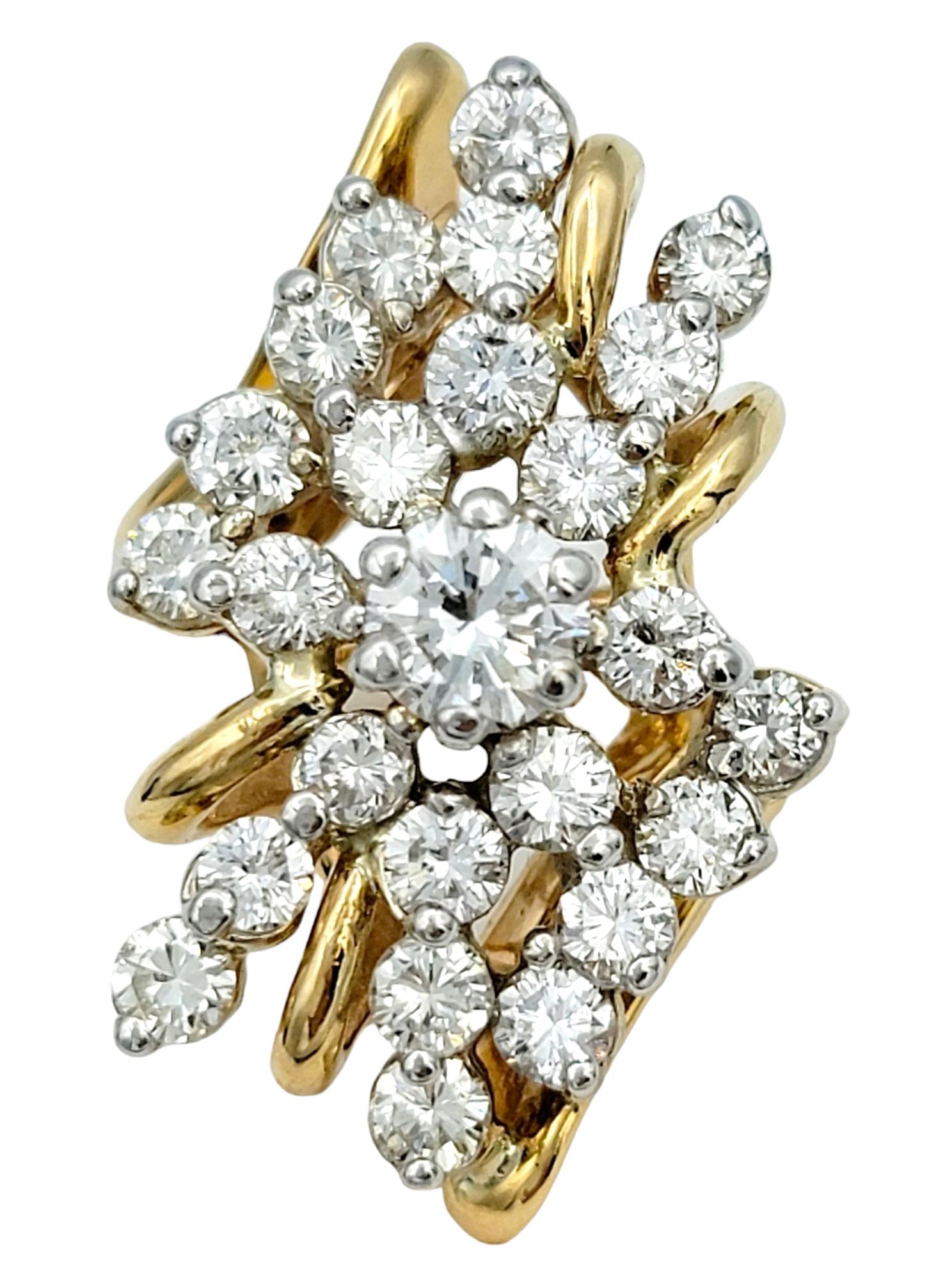 Ring Size: 6.75

This 14-karat yellow gold cocktail ring is a true marvel of design and versatility. Its centerpiece is a clustered assortment of round diamonds artfully arranged to form a captivating elongated marquise shape. The arrangement exudes