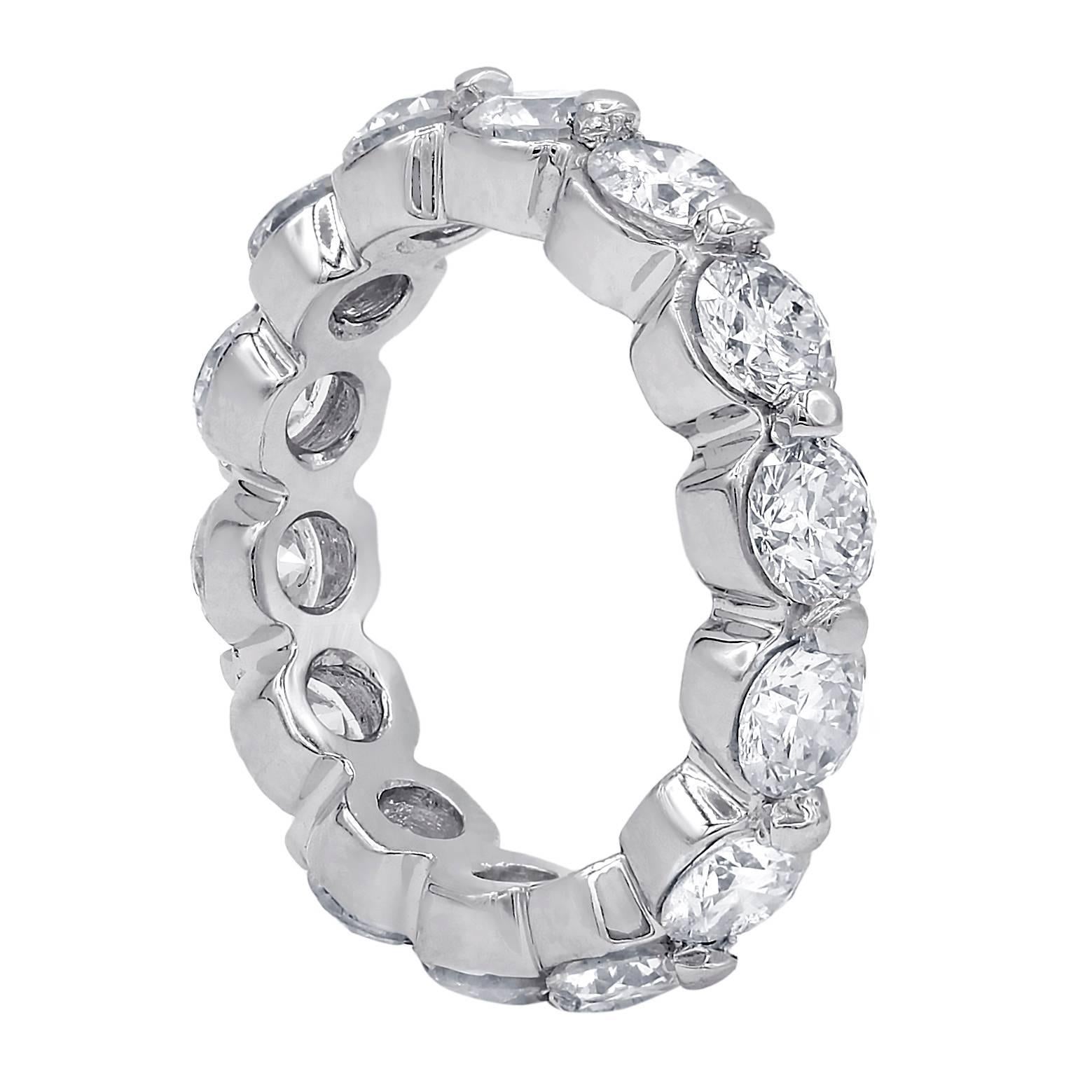 Custom made and common prong eternity band with 14 round brilliant cut diamonds,weighing 3.01 carats total FG color and slightly included clarity and set in 18 karat white gold mounting.