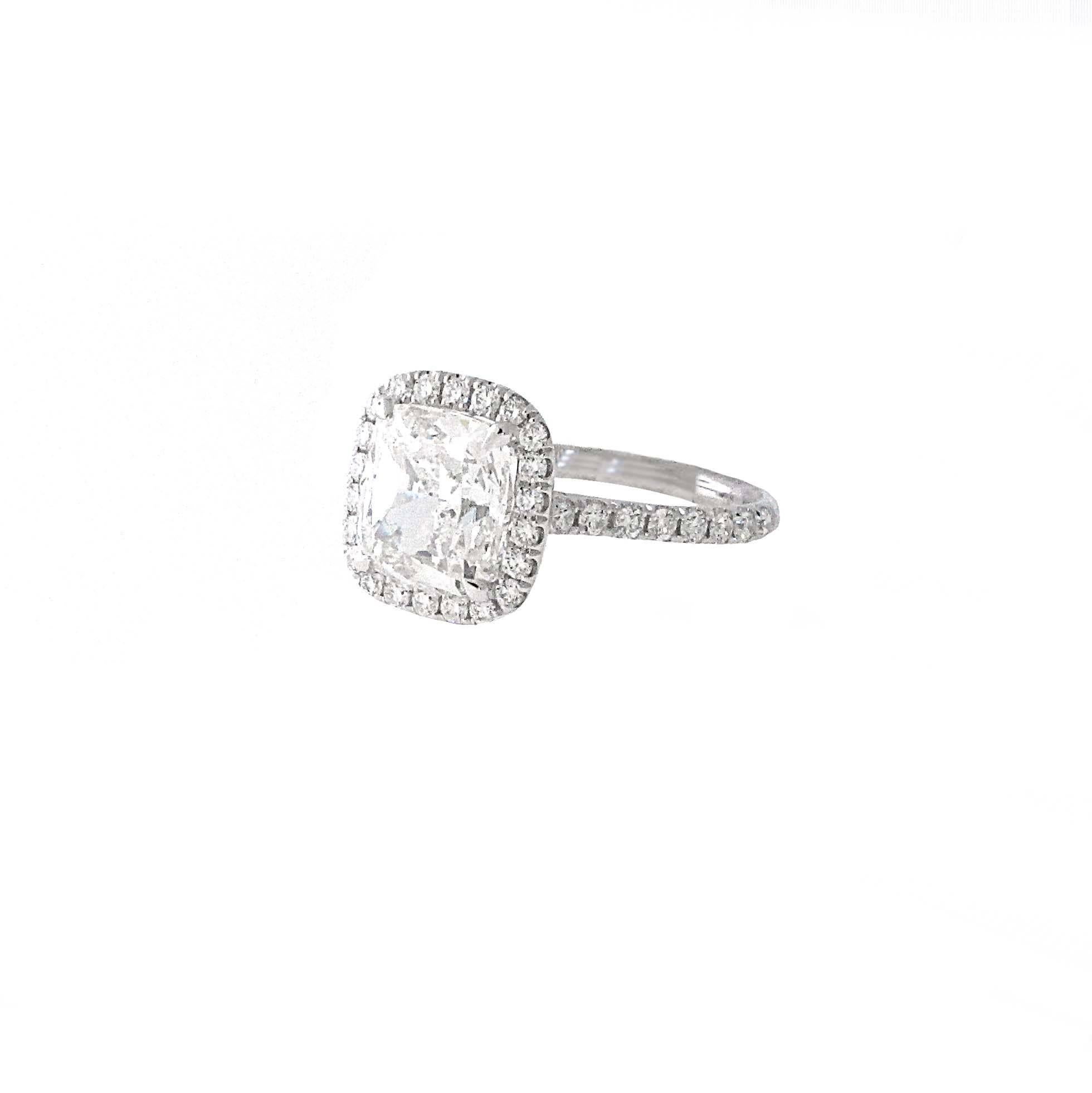 Hand made 3.01 GIA Certified Cushion Cut Diamond Engagement ring. This GIA Certified Cushion cut diamond is G color VVS1 Clarity
Ring is a size 6.  The mounting is platinum, not white gold, which makes it a higher quality ring. In the mounting there