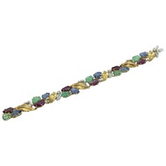 30.10 Carat Emeralds Sapphires Ruby Engraved Leaves 18 Carat Gold Bracelet