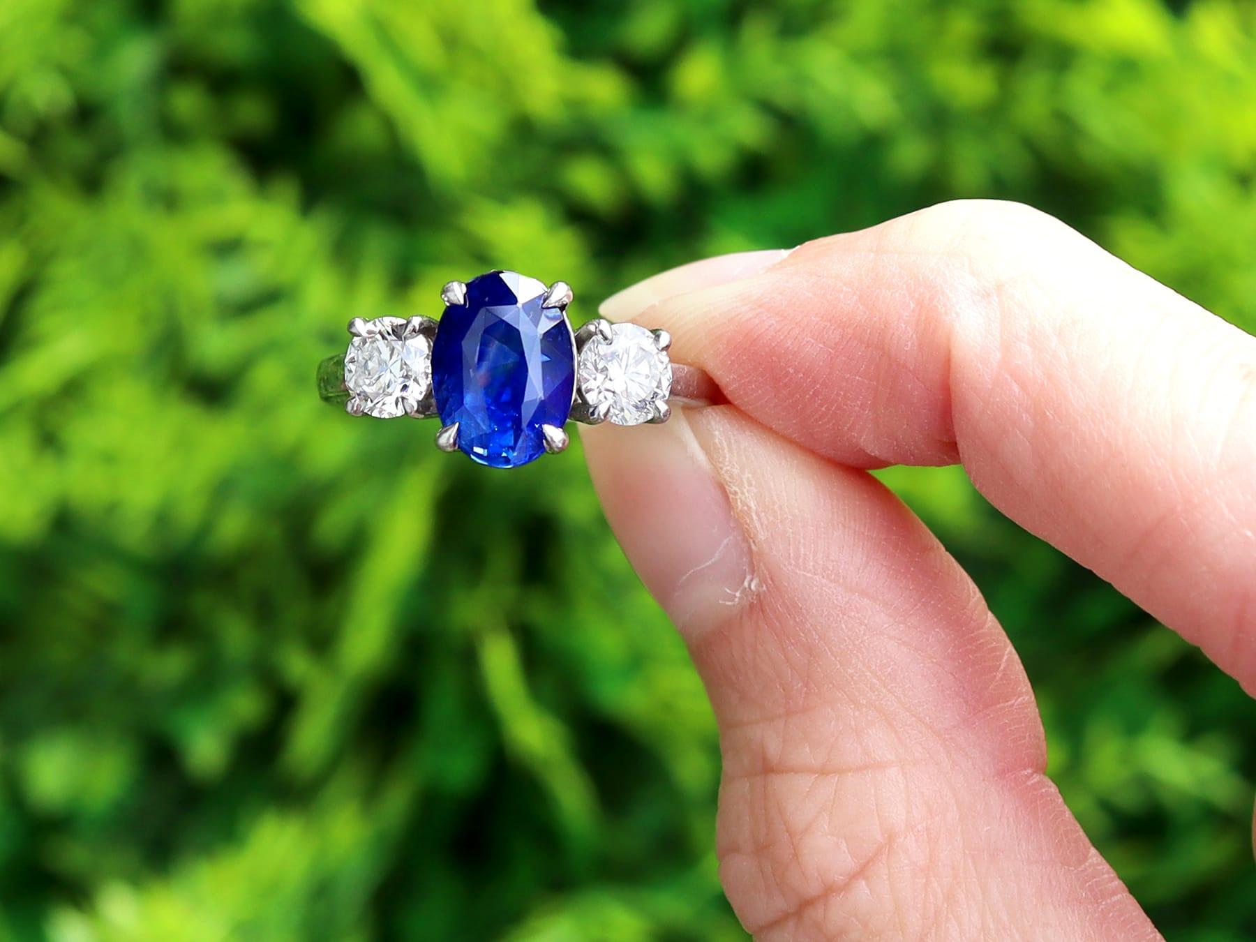 A stunning, fine and impressive vintage 3.01 carat Ceylon sapphire and 1.00 carat diamond, platinum trilogy ring; part of our diverse vintage sapphire trilogy rings collection.

This stunning, fine and impressive vintage sapphire ring has been