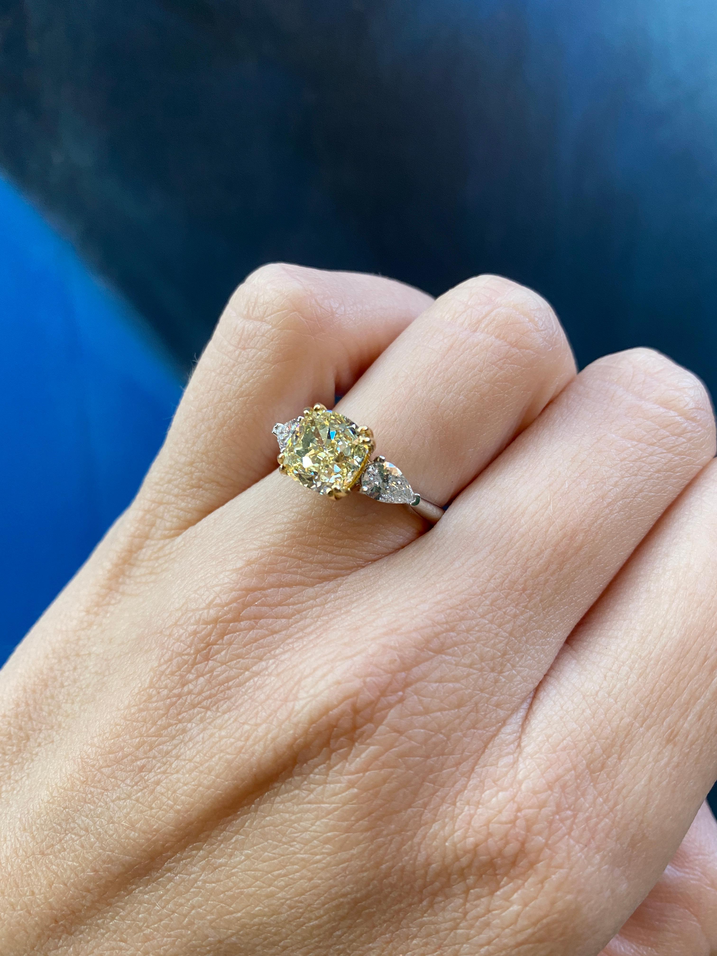cushion cut diamond with pear side stones