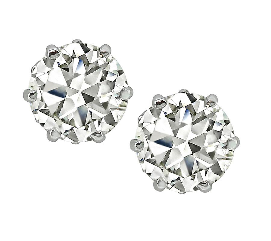 This is an elegant pair of 14k white gold stud earrings. The earrings feature sparkling European cut diamonds that weigh approximately 3.01ct. The color of these diamonds is K-L with VS clarity. The earrings measure 8mm in diameter and weigh 3