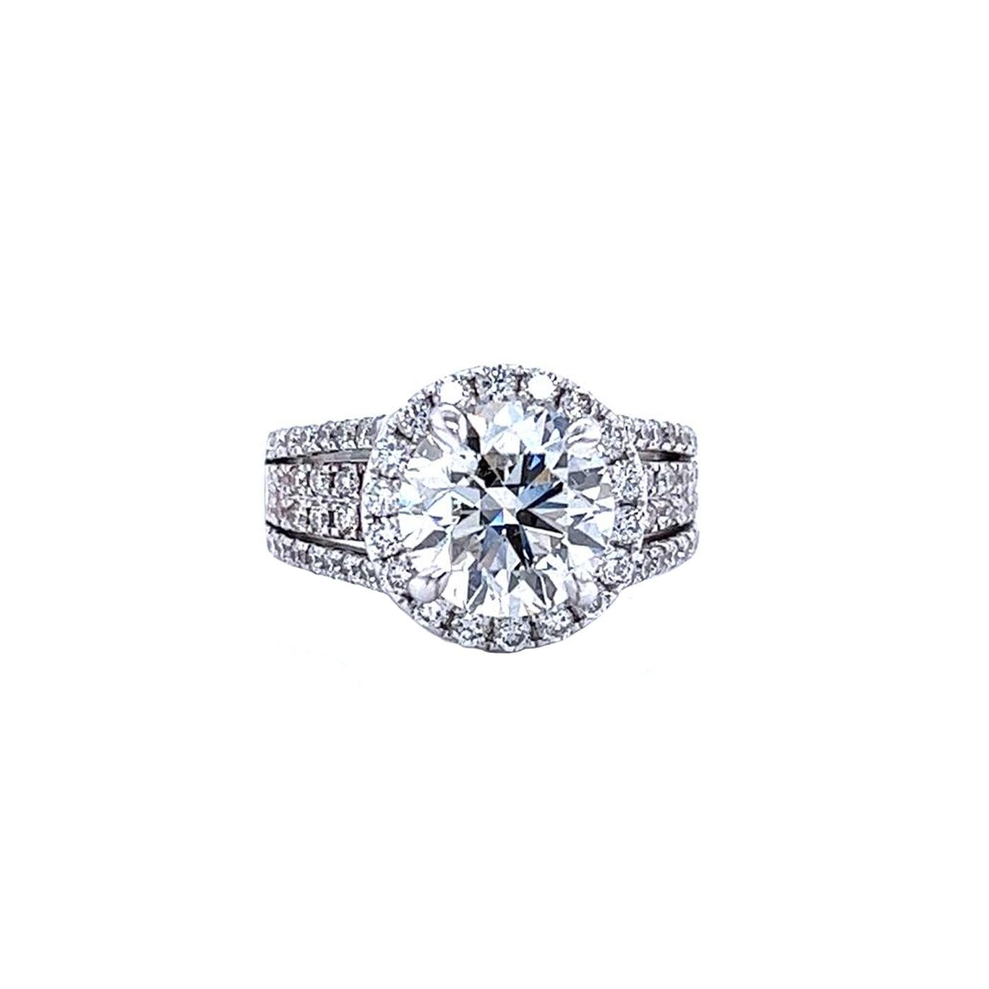 Always be on her mind when you purchase this Unique Diamond Ring. This exquisite certified ring features a delicate center Diamond that is surrounded by 2 Rows of Pave Diamonds. This intricately designed ring will really look amazing on your