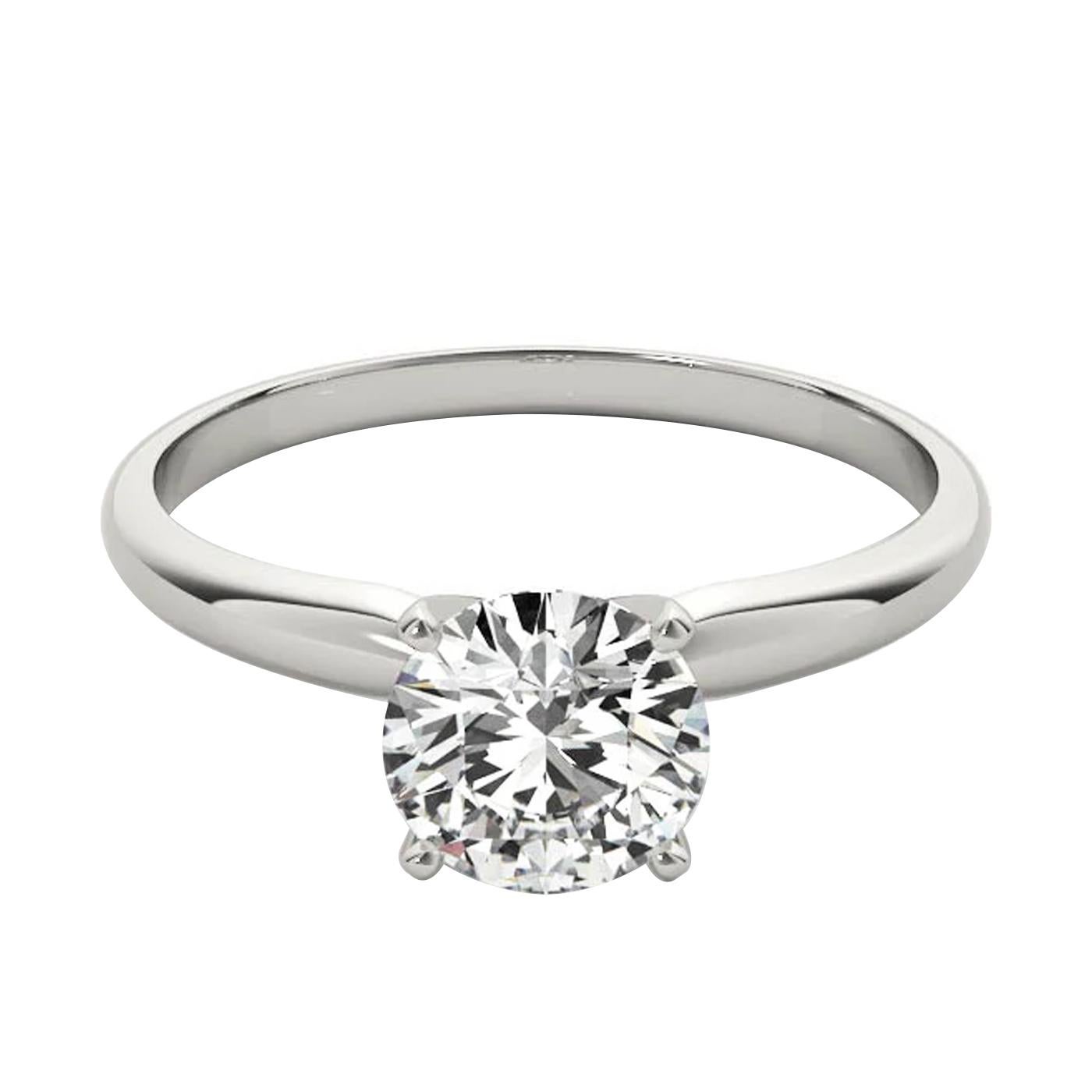 This ring features a delicate center diamond Features H color and Si1 clarity in 18K White Gold. This intricately designed ring will really look amazing on your bride-to-be’s finger and it will be a gift that she never forgets. Customize this ring